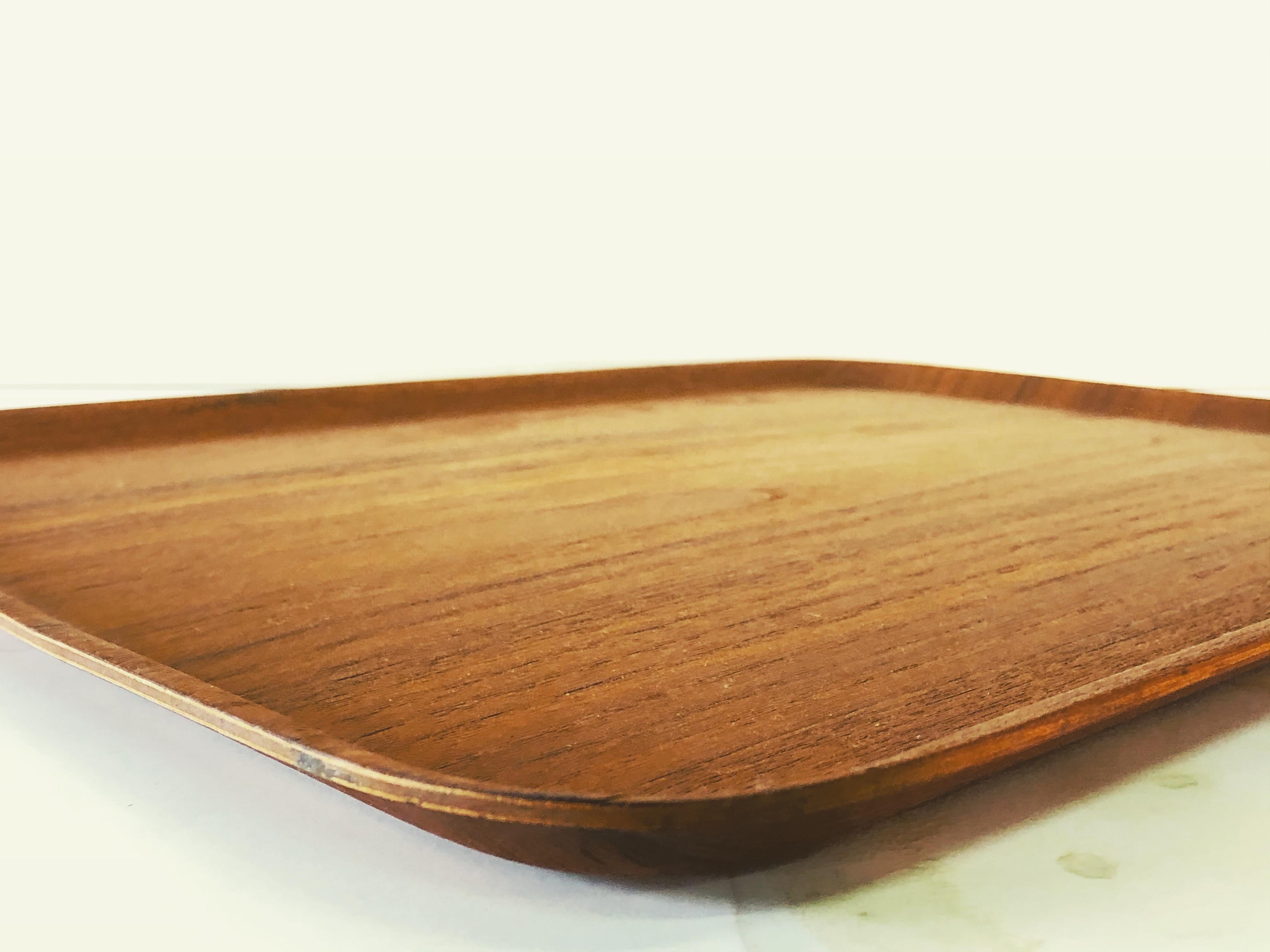 Vintage 1960s Swedish teak tray designed by Tapio Wirkkala for Kalmar. Newly refinished condition. Marked Kalmar & TW on the back.