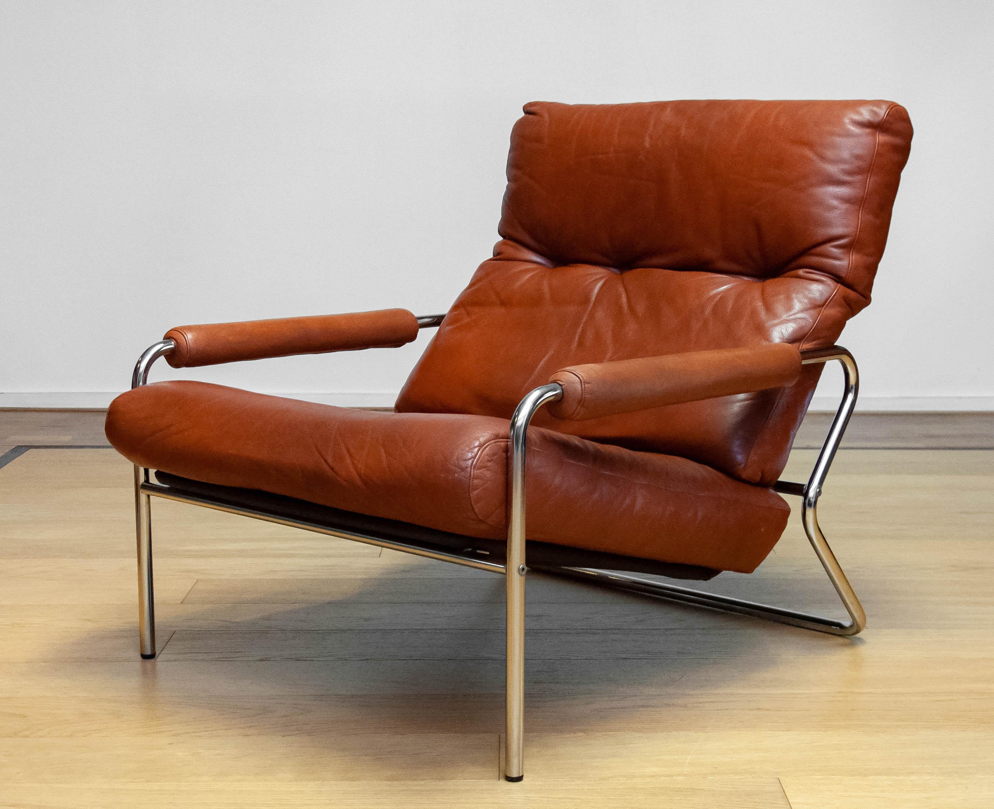 Metal 1960s Swedish Tubular Chrome And Brown Leather Brutalist Lounge Chair