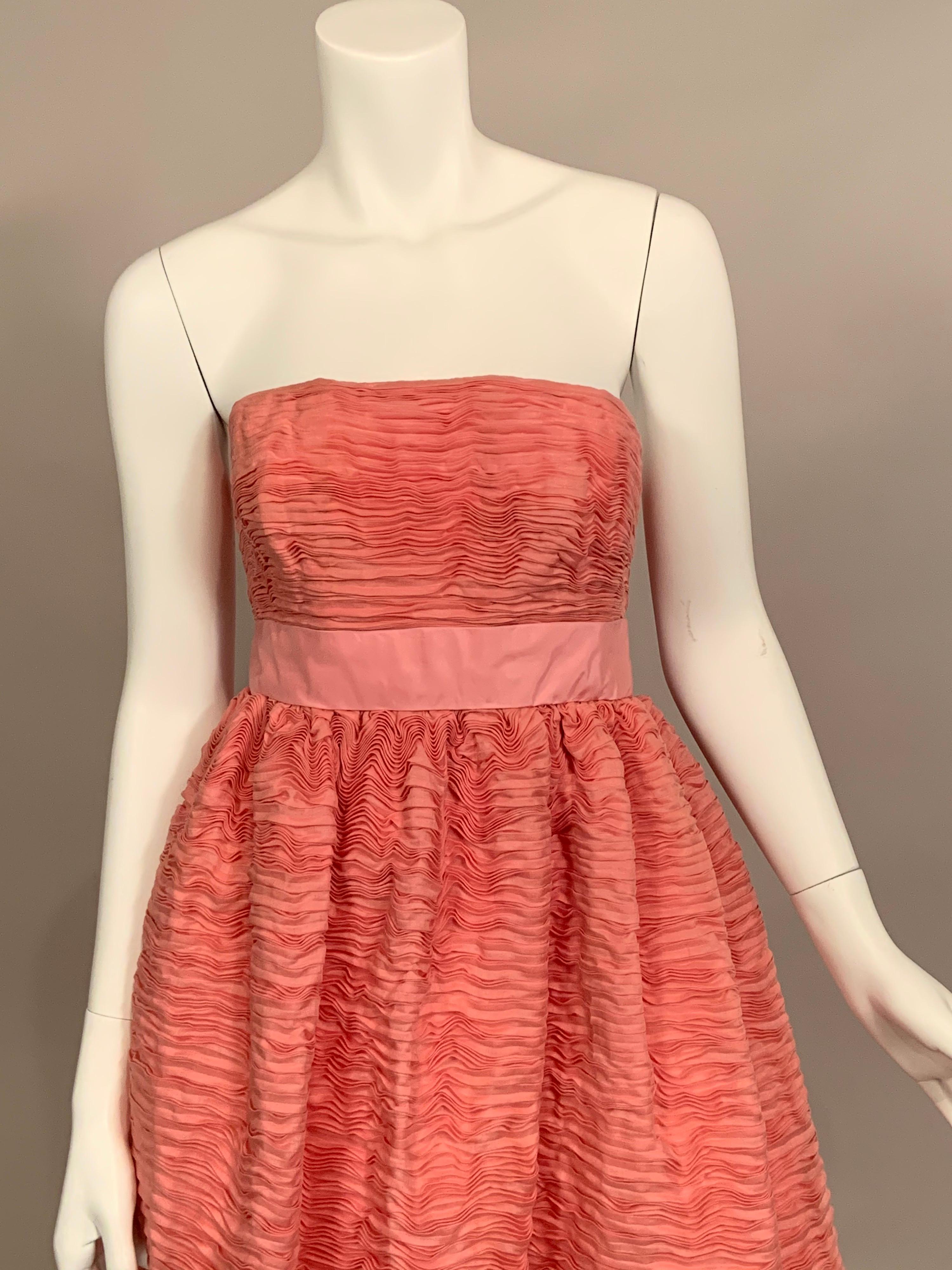 Sybil Connolly is most famous for her extremely rare pleated linen clothing.  This strapless pink gown is a stunning example of these pleated designs.  They are made from handkerchief linen which is hand dyed and then pleated.  It takes nine yards