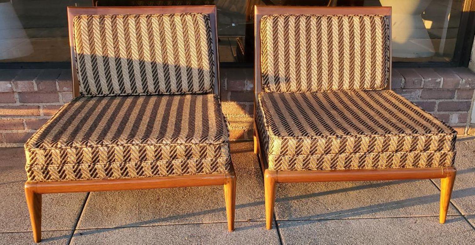 T.H. Robsjohn Gibbings low lounge chairs or slipper chairs (A Pair).
Both lounges are in excellent condition.
Strong wood frames with beautiful upholstery.
No rips, no tears, no holes, no marring.
Excellent condition condition for it's