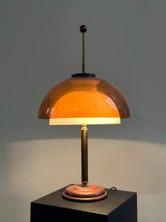 1960s table lamp, by Reggiani, with a white glass and brown plexiglass diffuser