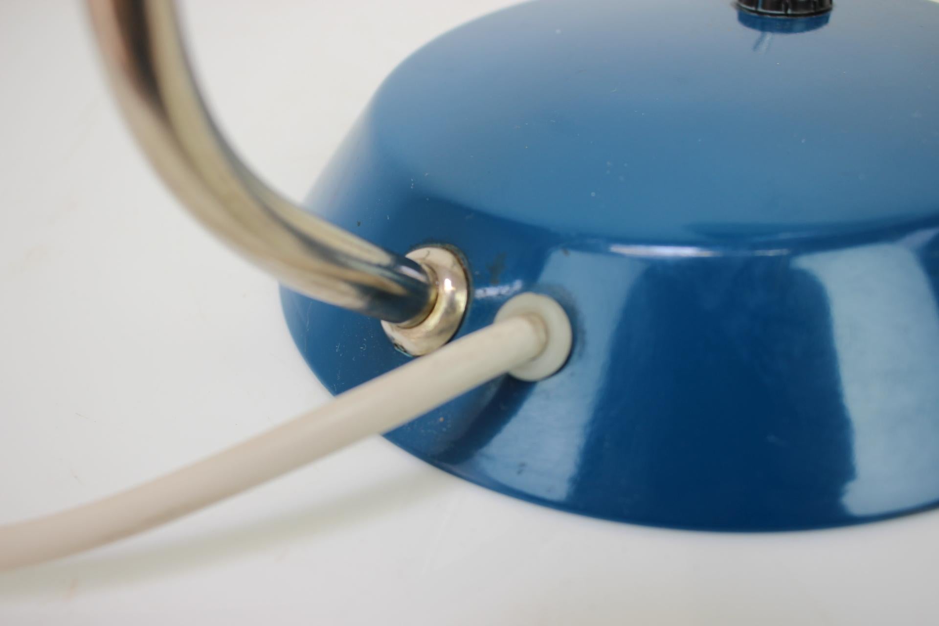 Mid-century table lamp, made in former Czechoslovakia in the 1960's. 
Overall a simple lamp to light up your room.
Made of metal and chrome.
Fully functional, repolished, cleaned, in original condition, with a few signs of use (shown in the pictures