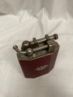 1960's table lighter in leather with a crown emblem