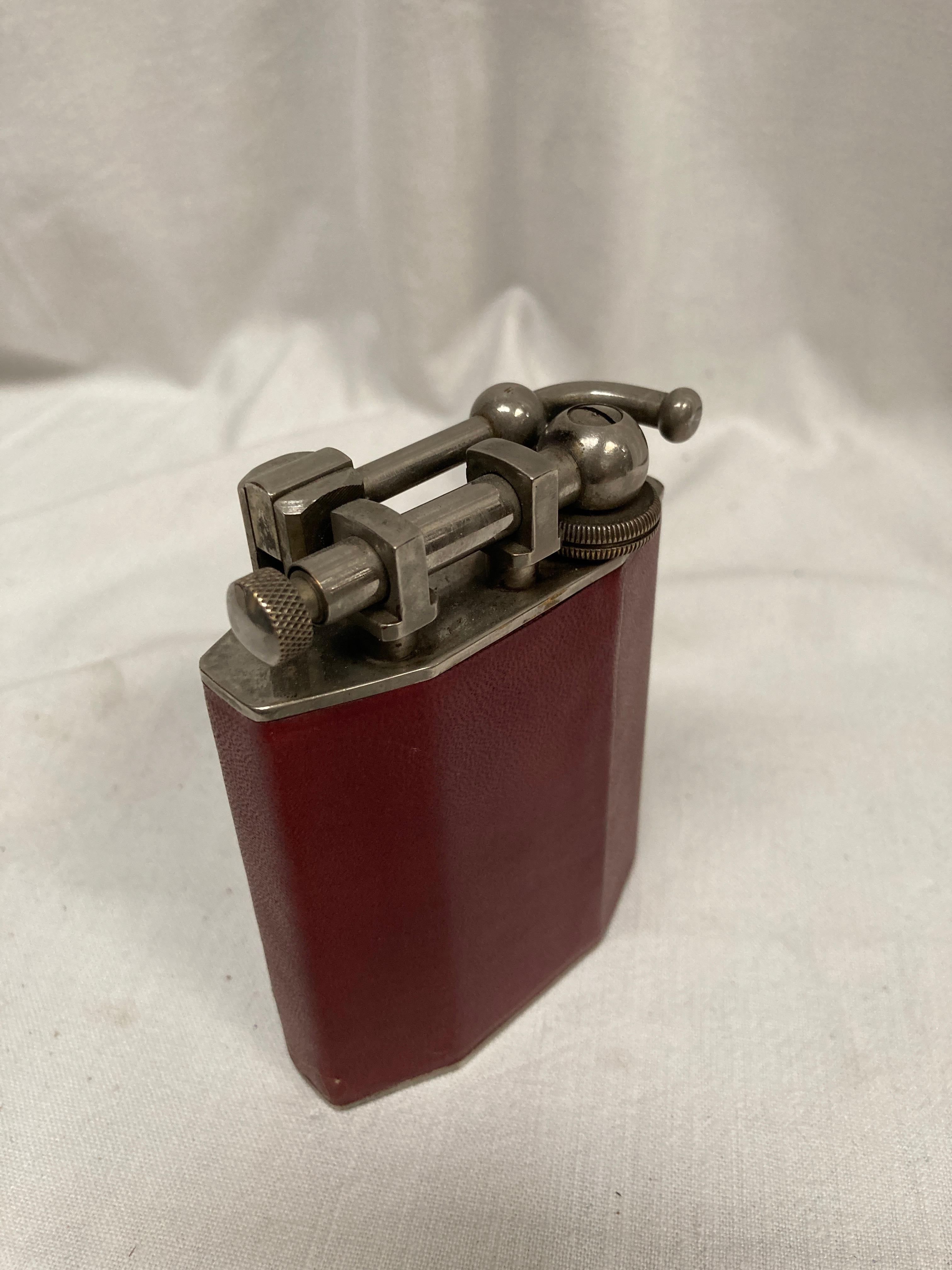 French 1960's table lighter in leather with a crown emblem  For Sale
