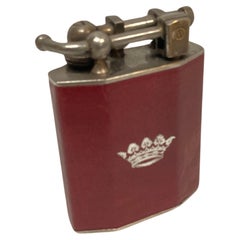 Retro 1960's table lighter in leather with a crown emblem 