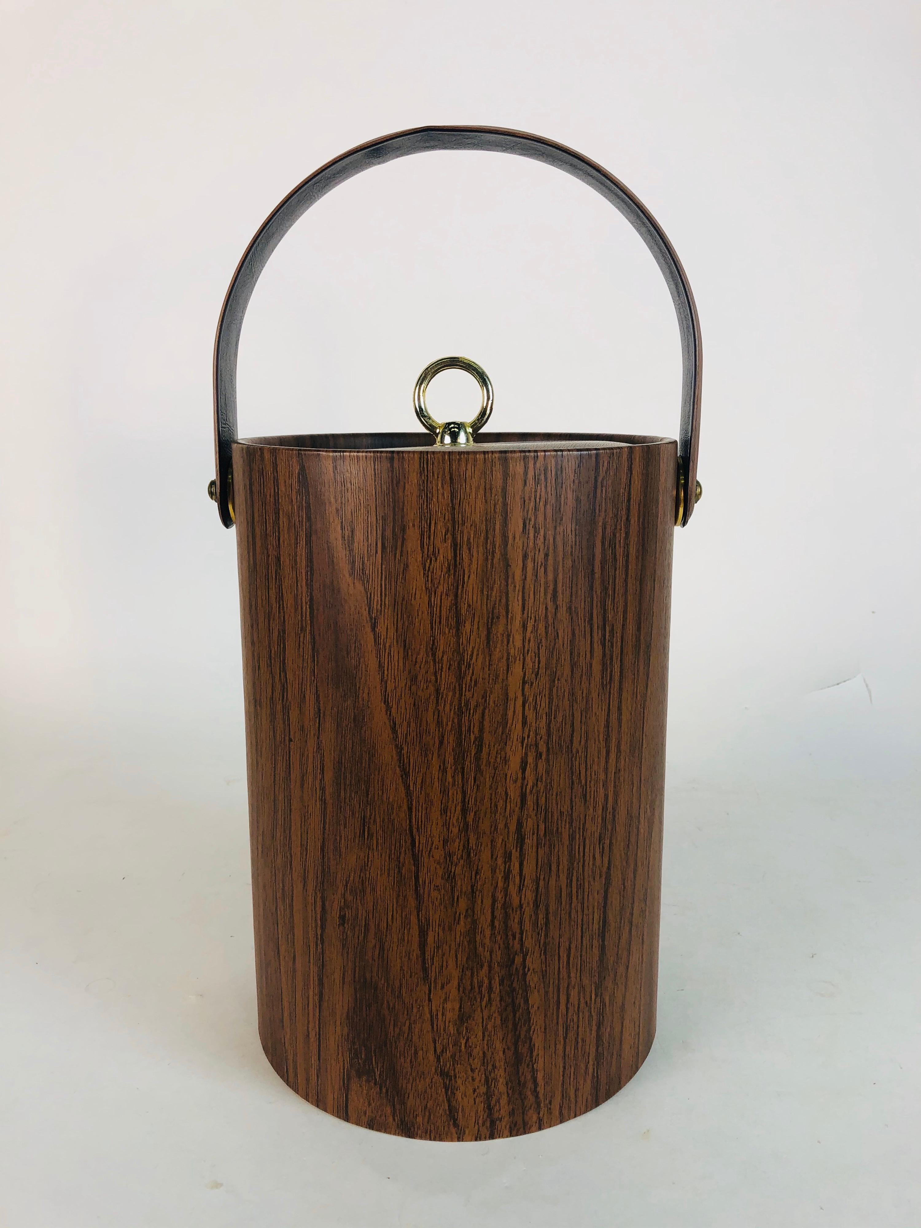 1960s tall vinyl faux-wood grain handled ice bucket with metal knob. Excellent condition, holds a lot of ice! No marks.