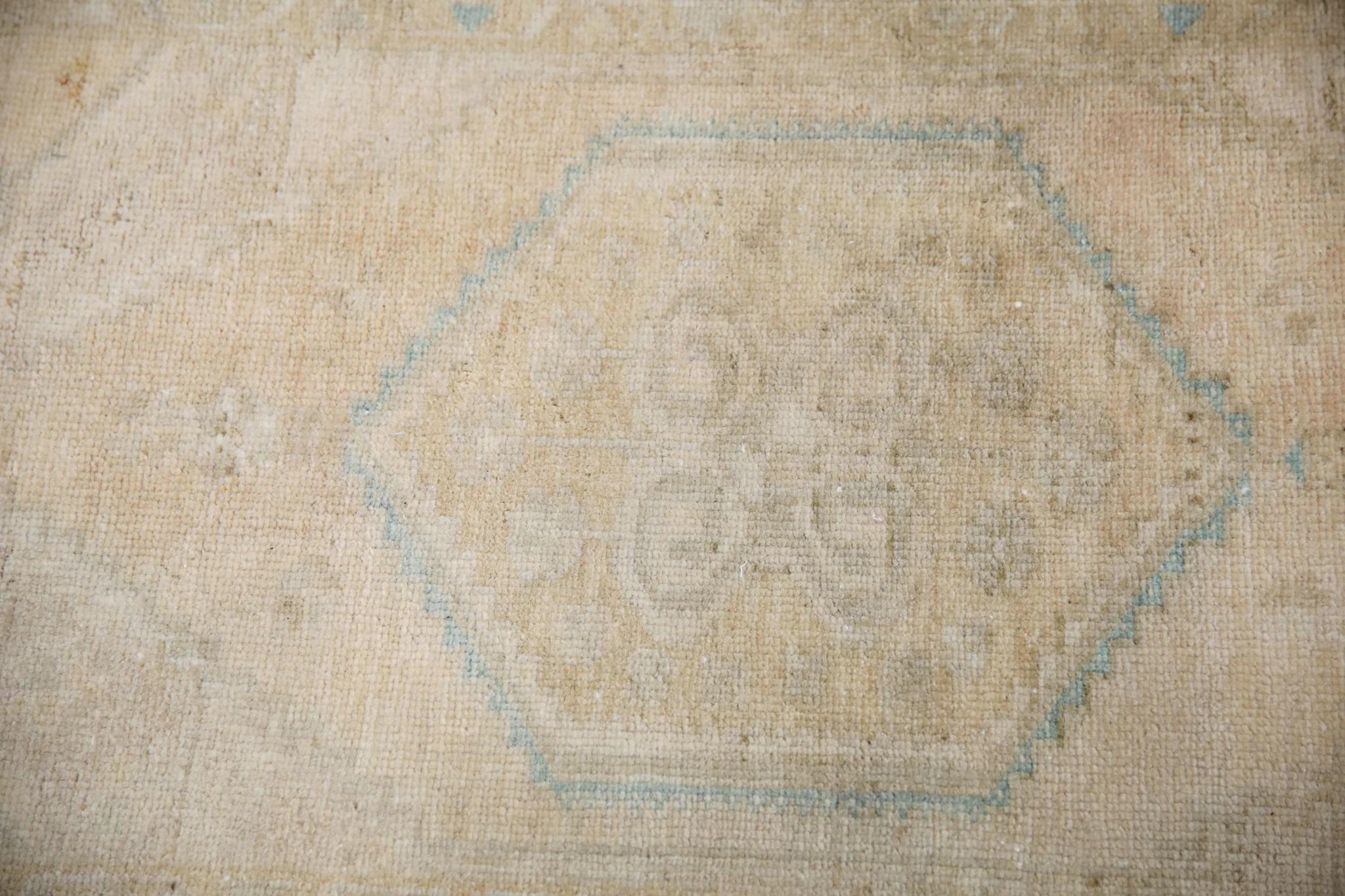 Introducing our exquisite vintage mini Turkish rug, expertly crafted by skilled artisans using traditional techniques that have been perfected over centuries. Made entirely from 100% handwoven wool, this rug boasts a soft and durable texture that
