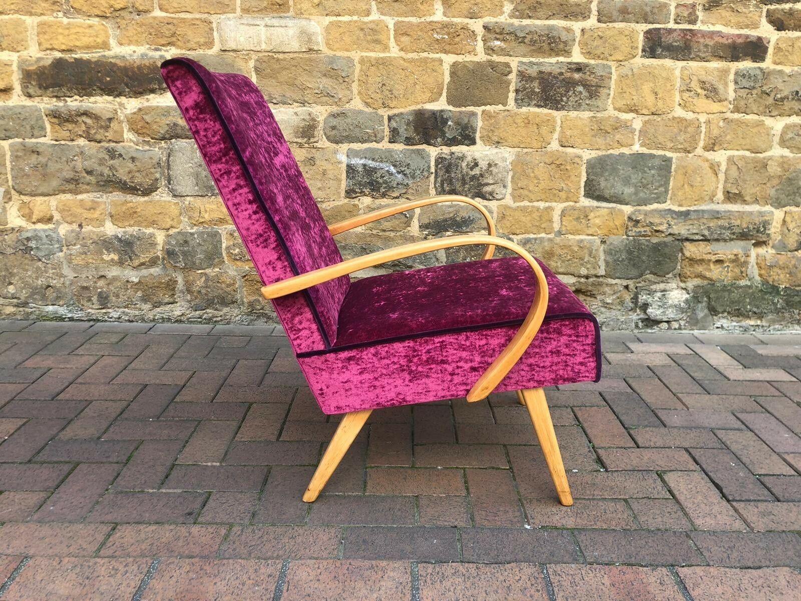 Beautiful 1960s Czech armchair designed by Jirak Frantisek and manufactured by Tatra.

Newly upholstered in a fuchsia pink velvet with contrasting purple piping.
  