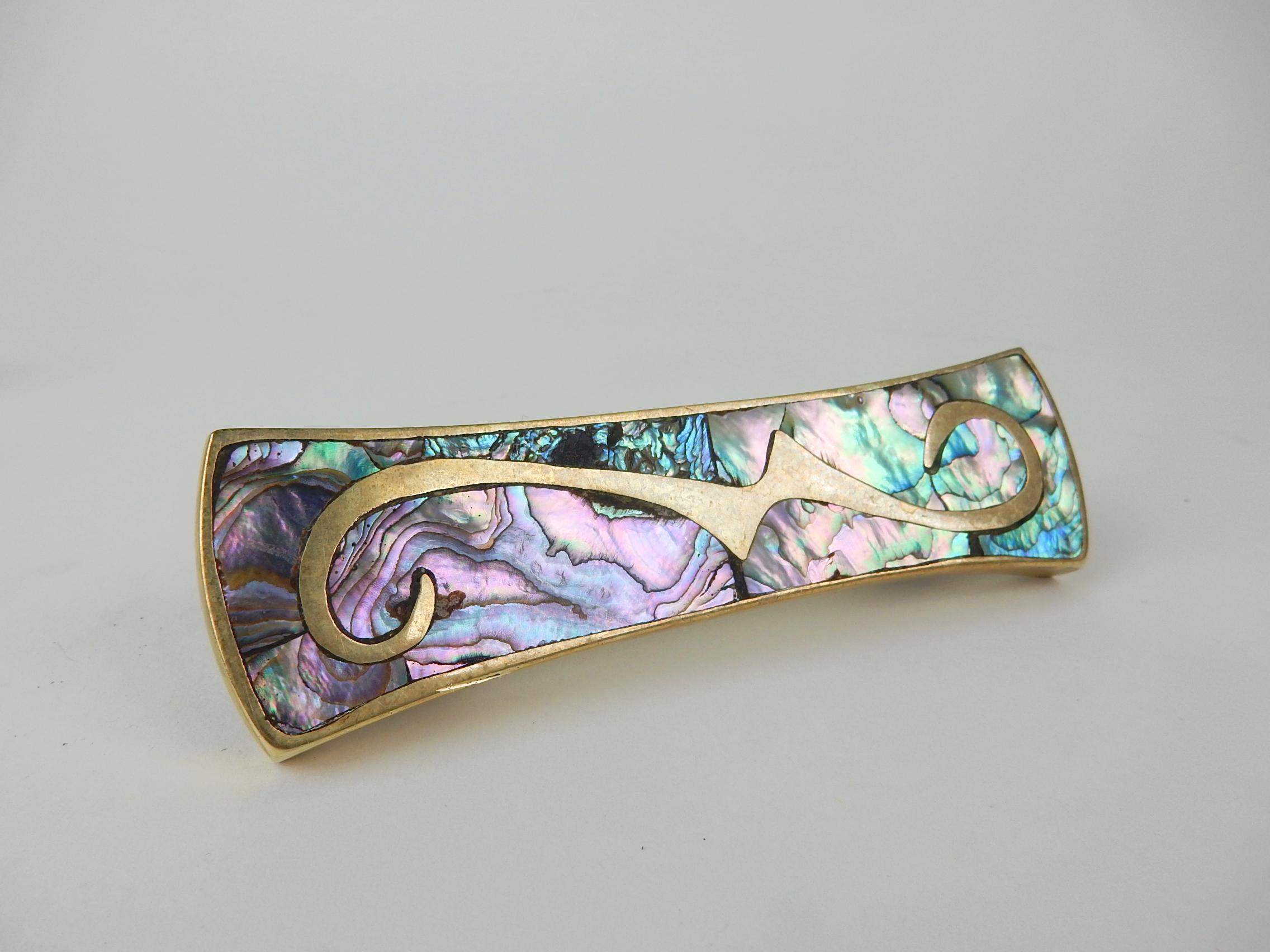 Gorgeous set of 4 1960s abalone and brass door or drawer pulls from Taxco Mexico
in the style of Pepe Mendonza.
These would be a phenomenal addition to a cabinet, screen or closet doors.
For reference holes are 3 inches across, center to