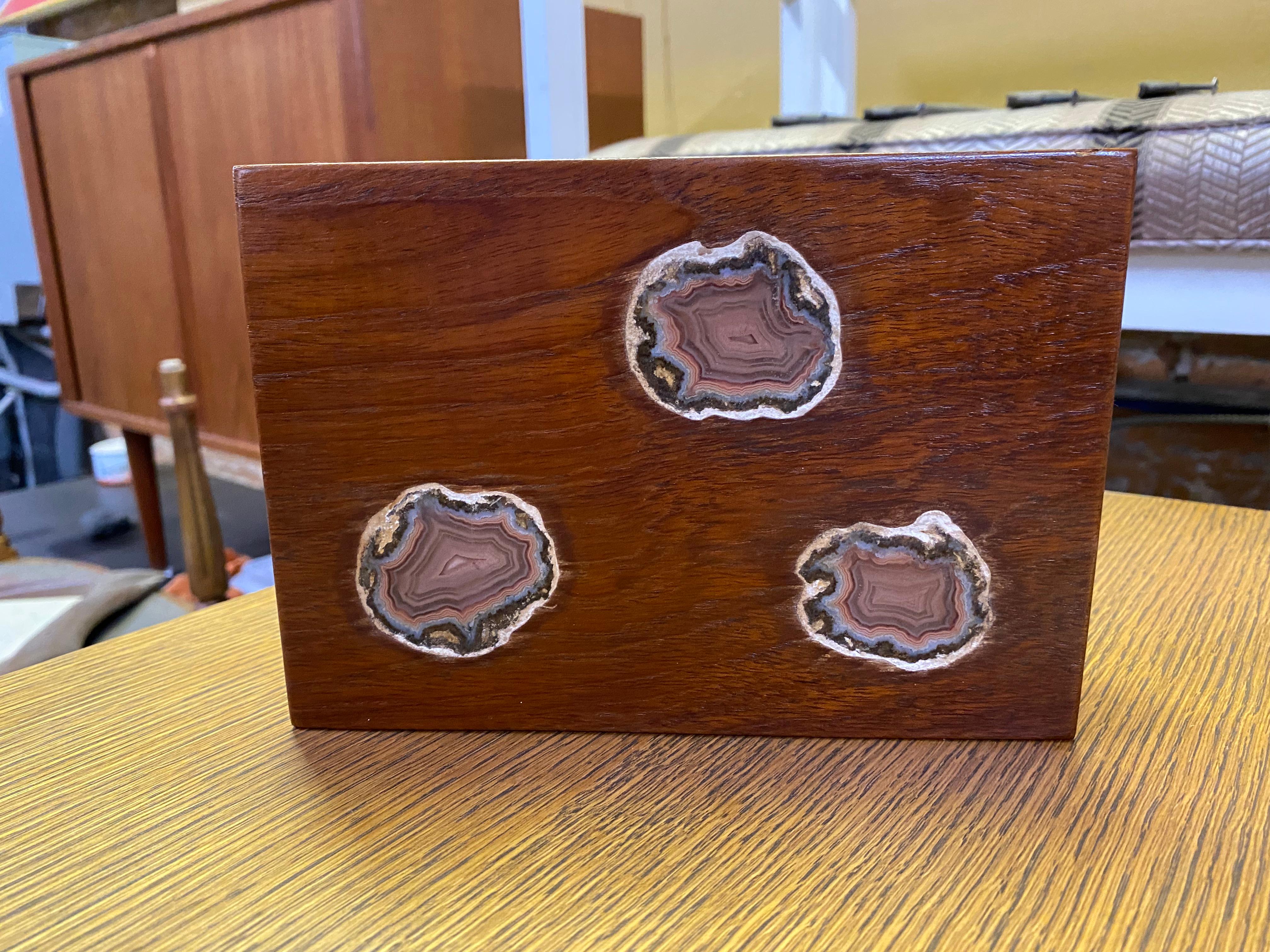 A superb bench made teak and agate geode inlaid nigh light. A teak light box that contains three very small watt bulbs that light up behind the geode inlay. Circa 1968-70.

Approximate measurements are 2.5