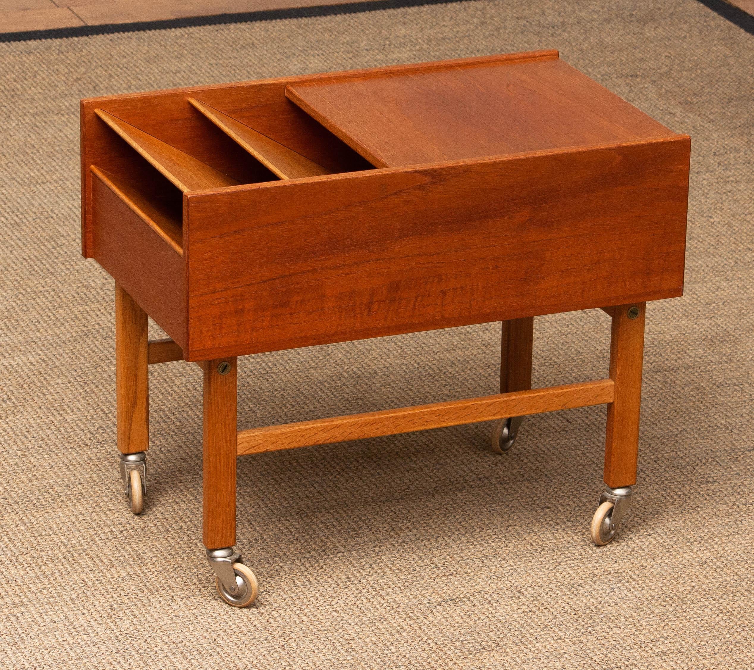 Scandinavian Modern 1960's Teak and Oak Side Table with Magazine Storage and Sliding Top Denmark For Sale