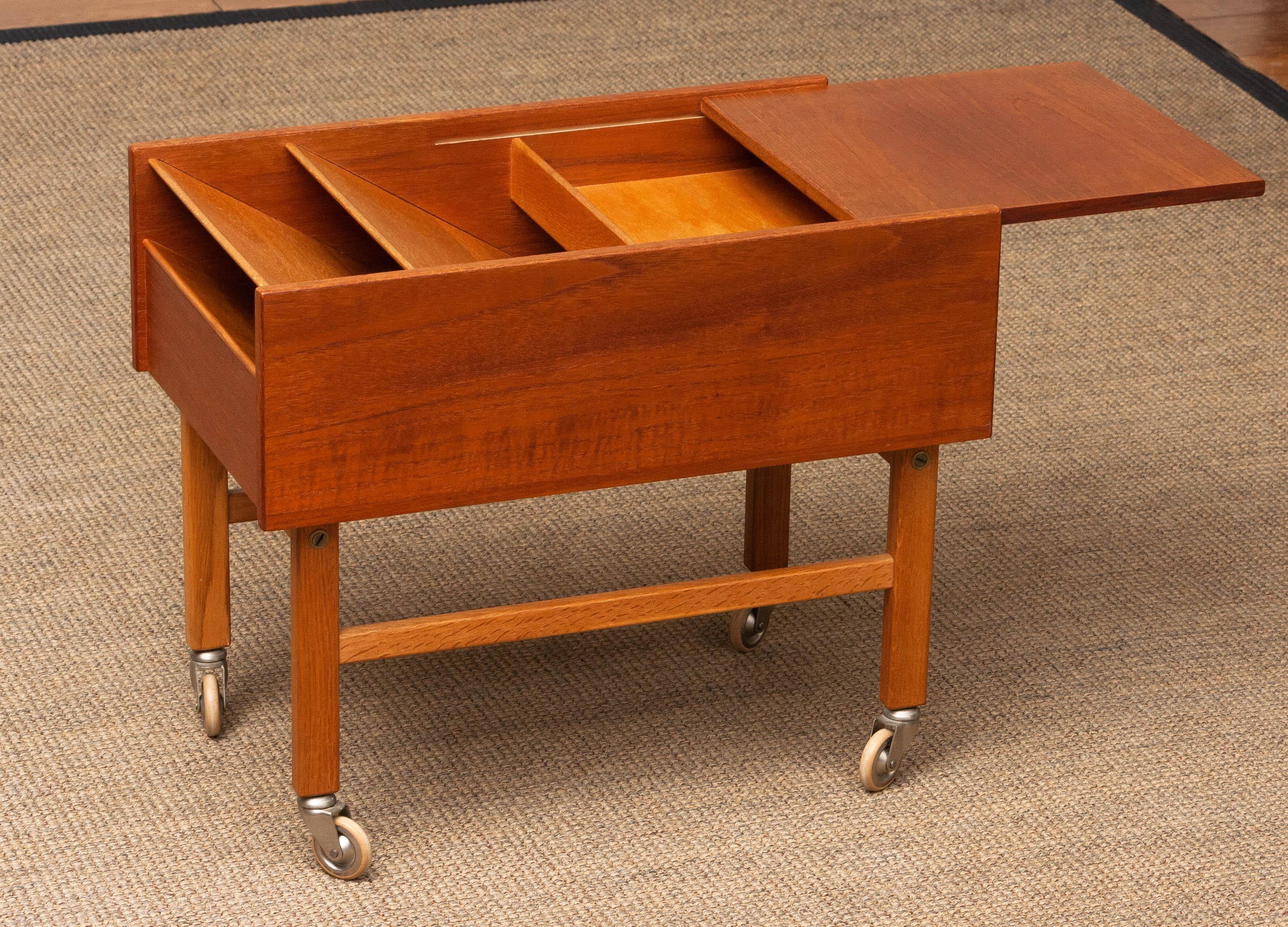 Danish 1960's Teak and Oak Side Table with Magazine Storage and Sliding Top Denmark For Sale