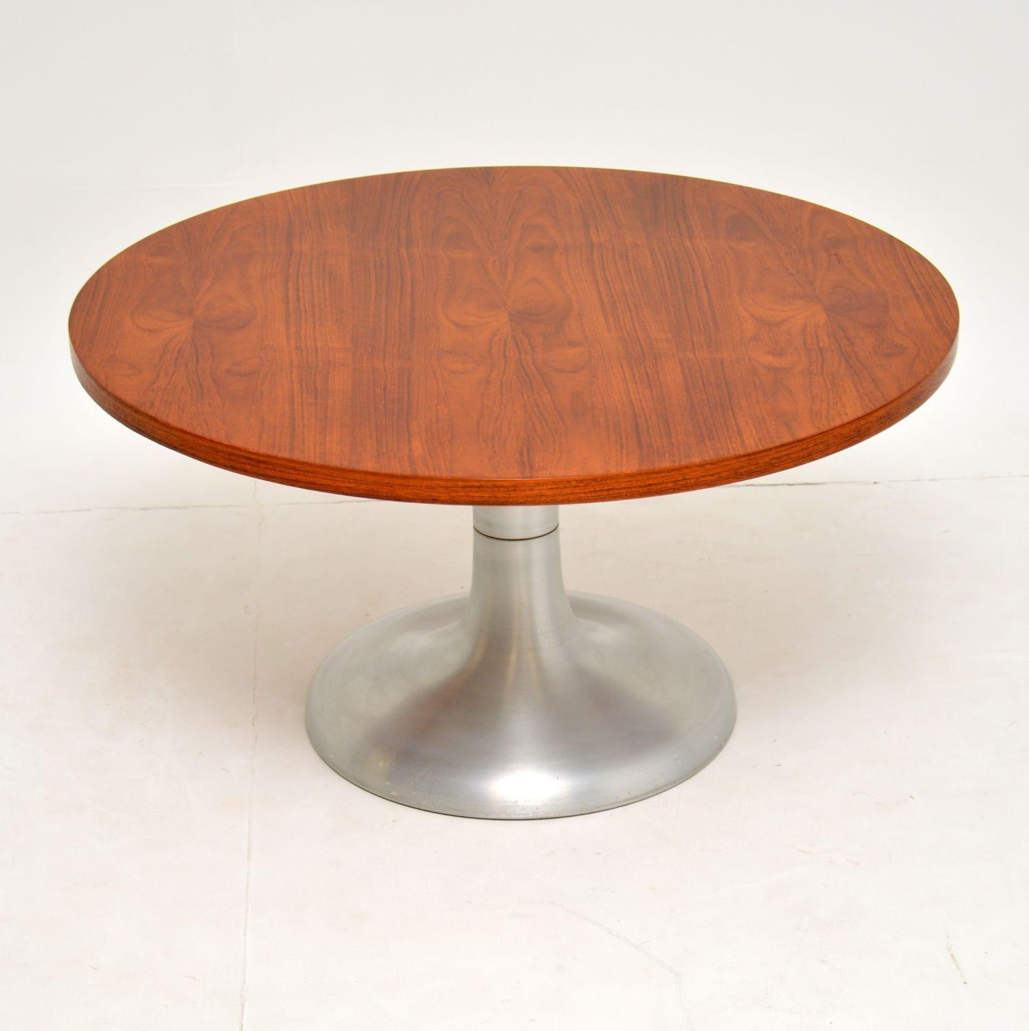 A stylish and very well made vintage coffee table, this dates from the 1960s-1970s. It has a beautiful circular teak top, and sits on a brushed steel tulip base. We have had the teak stripped and re-polished to a very high standard, the condition is