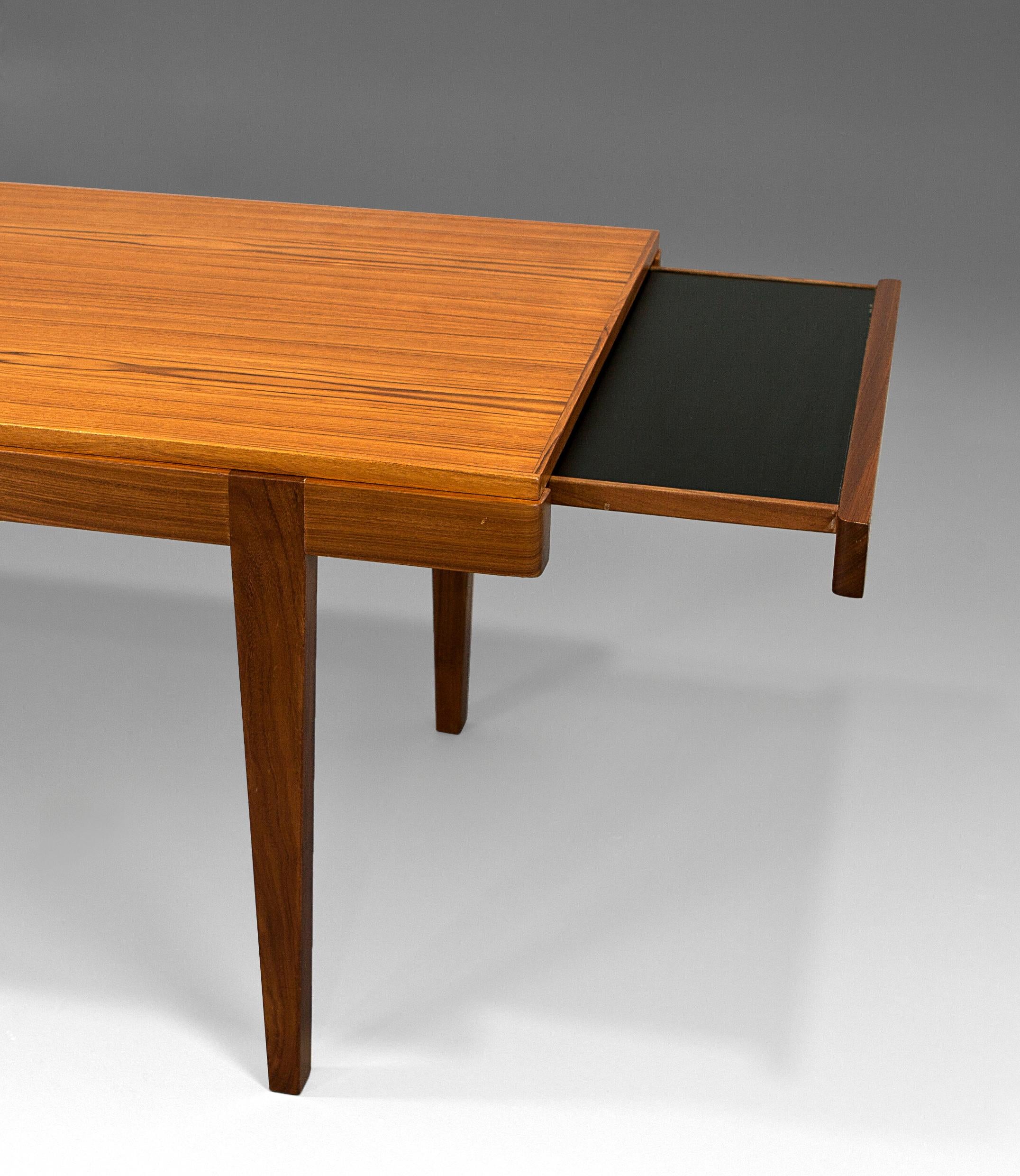 Coffe table, probably swedish, en teak with removable extensions in formica laminate, 60's.
Mint condition, fully refinished.
 
