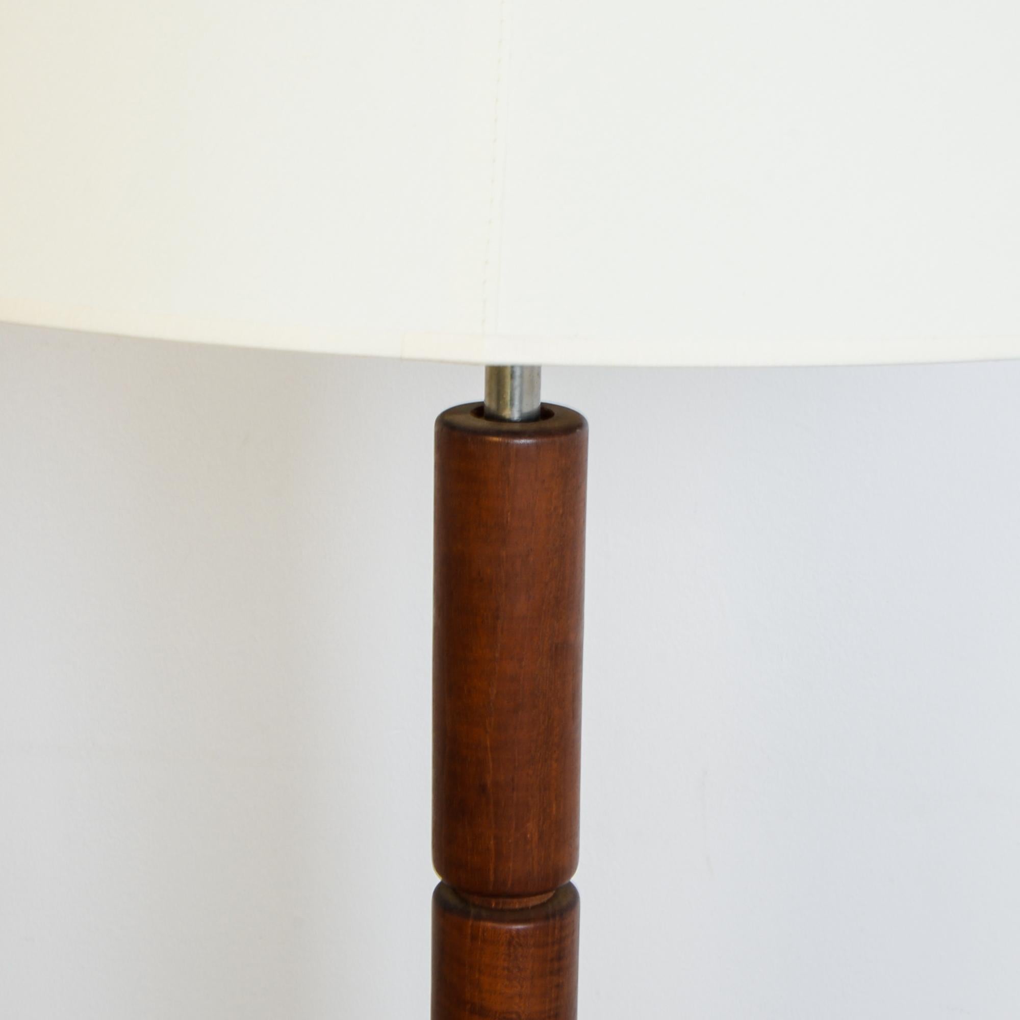 A hardwood lamp base from Denmark, circa 1960. Influenced by mid-20th century Danish modern furniture style, this lamp has a striking geometric profile, with modular elements carved from durable teak. Scandinavian style electrified, with updated