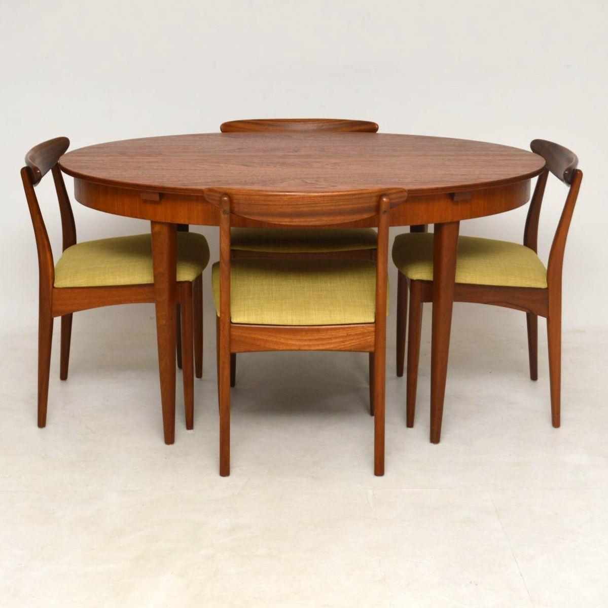 A beautifully made and very stylish vintage dining table and six dining chairs in teak. These were made in England by Greaves and Thomas, they date from the 1960’s.
The oval dining table seats four when closed, when opened it could comfortably seat
