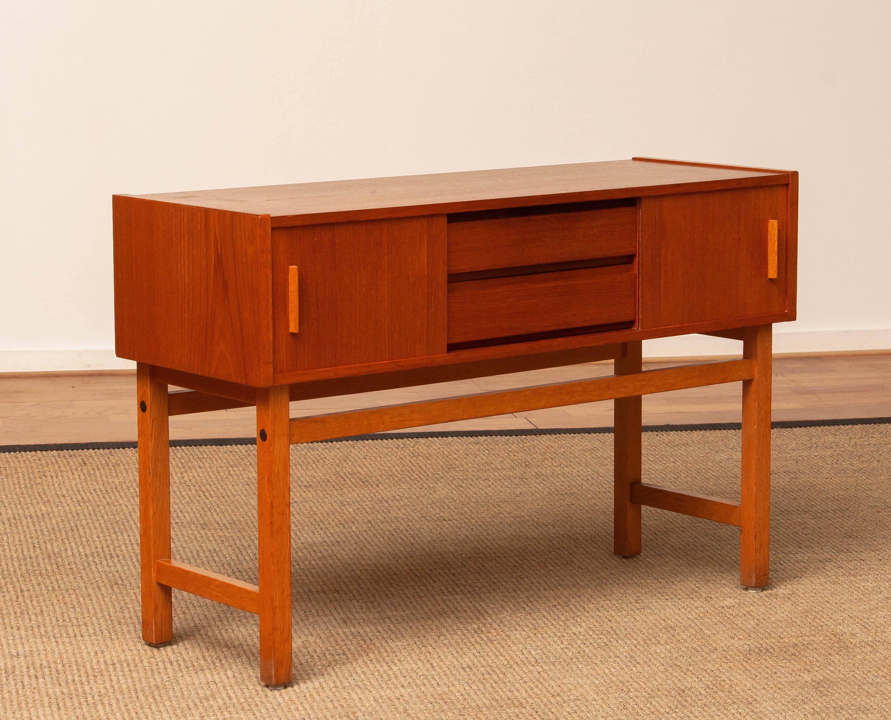 Swedish 1960s Teak Cabinet / Credenzas / Console With Drawers And Sliding Doors. Sweden. For Sale