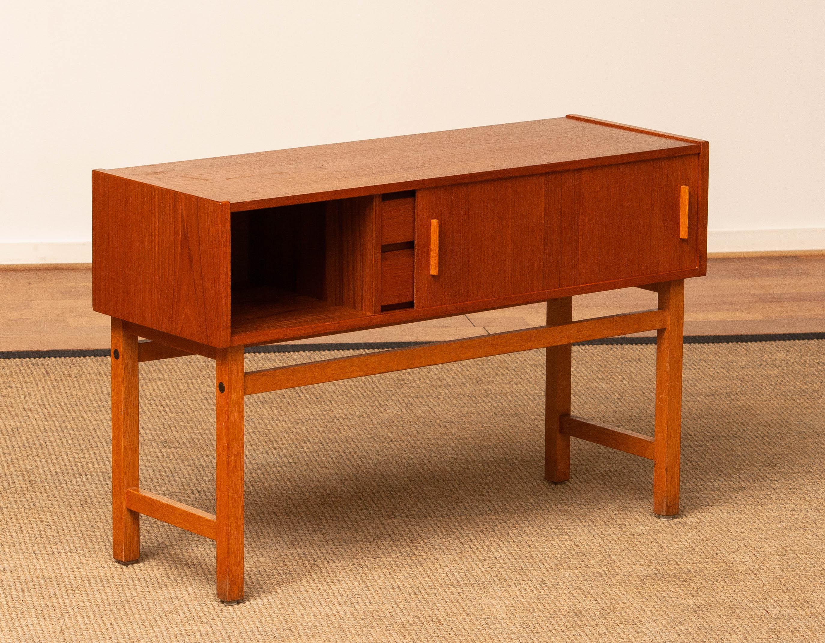 Mid-20th Century 1960s Teak Cabinet / Credenzas / Console With Drawers And Sliding Doors. Sweden. For Sale