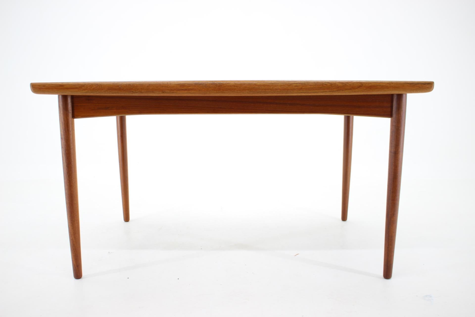 This top of the table is made of teak wood veneer and the central leg from stained beechwood. 
This item was carefully restored.
250 cm when extend.