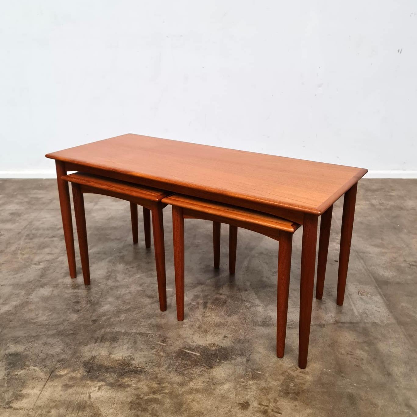 1960’s Parker Nordic Nesting Tables. 
Featuring beautiful grain finish with rounded bullnose edges and tapered legs.

Freshly stripped and refinished.

Mother - H 44cm, L 90cm, W 38cm
Babies - H 38cm, W 38cm

Please contact us for an Australia wide