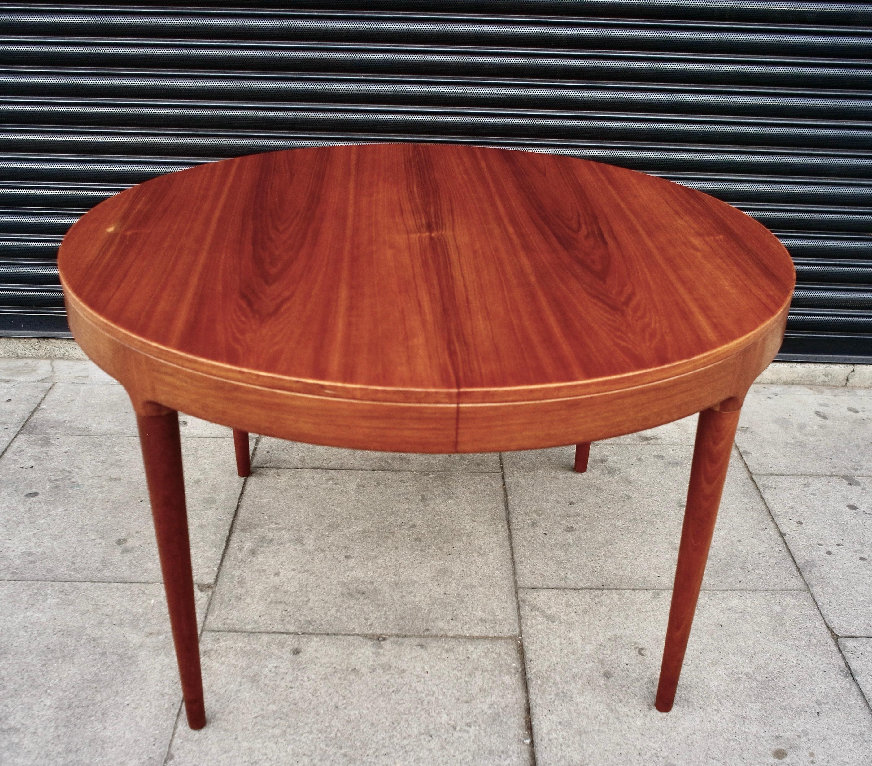 A vintage 1960s Danish round teak extendable dining table designed by Neils O Moller. This dining table has all the Classic characteristics of midcentury Danish design, with the simple lines and attention to detail, accompanied with the quality of