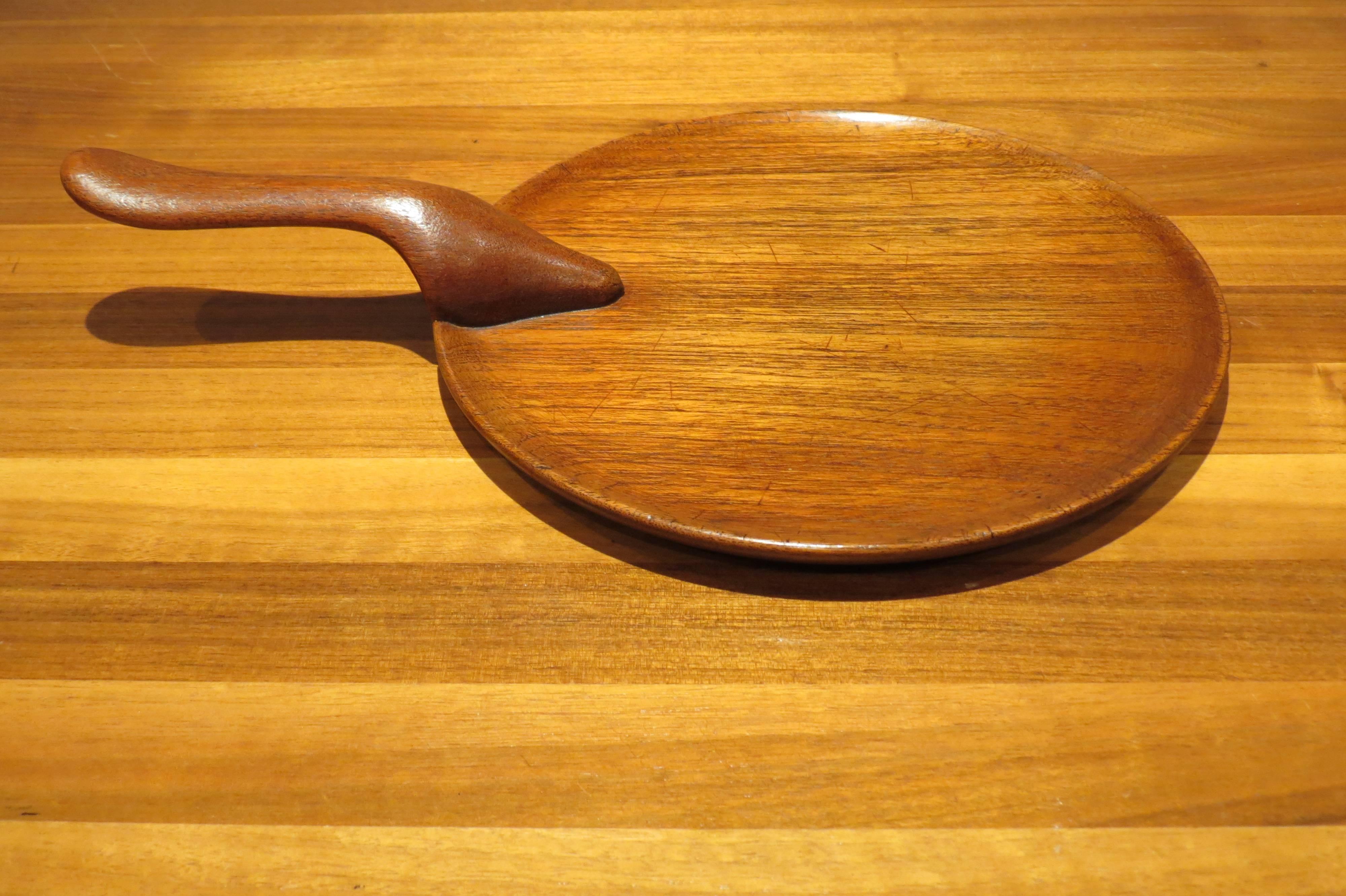 1960s teak serving tray by Kay Bojesen.

Serving tray in solid teak from the 1960s, designed and manufactured by Kay Bojesen, Denmark. 

In good condition, a few scratches to the surface consistent with age. 

Stamped to the underside Kay