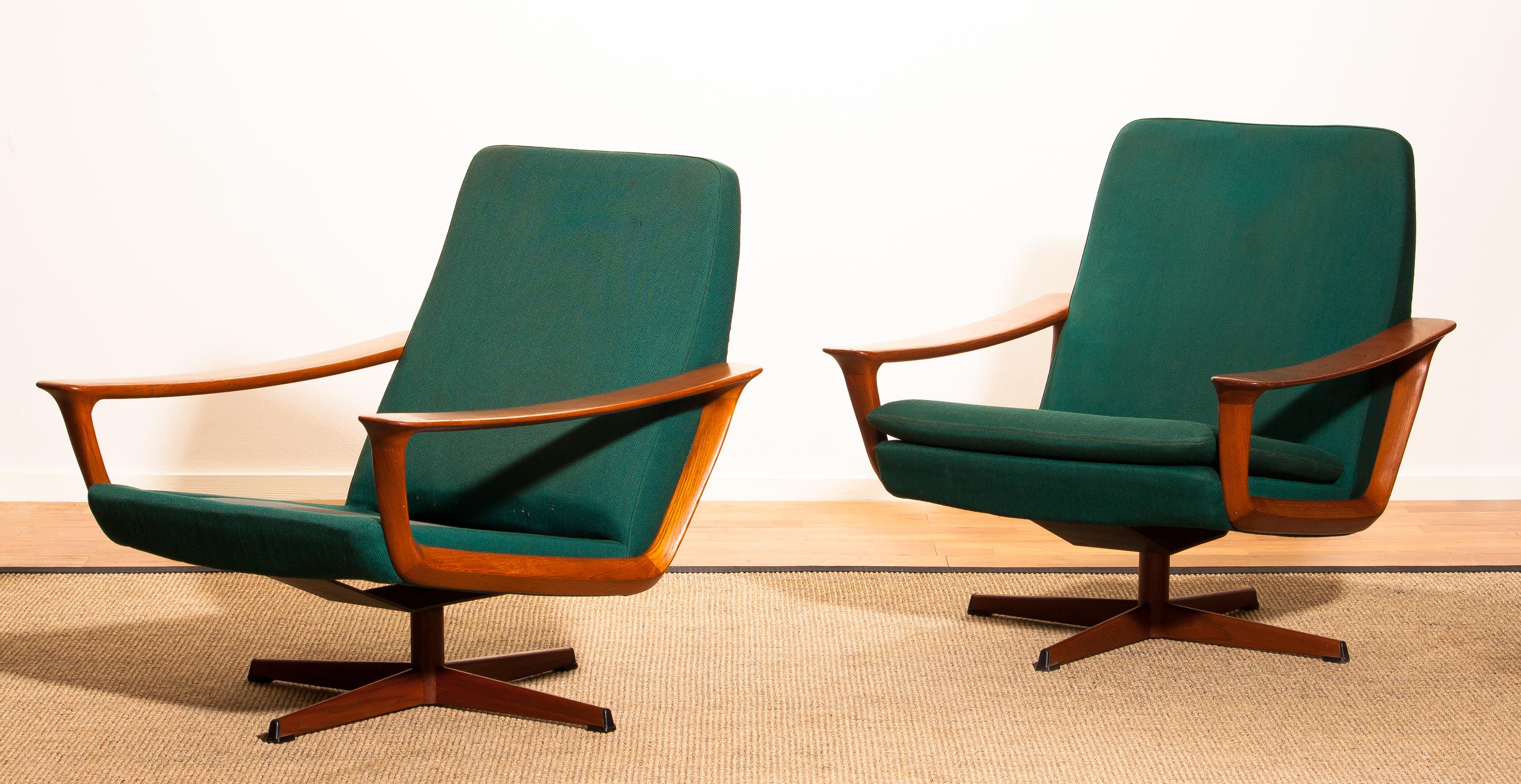 Extremely rare teak swivel chair by Johannes Andersen for Trensum, Denmark.
The chair to the right is in excellent condition.
Upholstery and padding shows wear consistent with age and use.
The chair to the left is also in perfect condition except