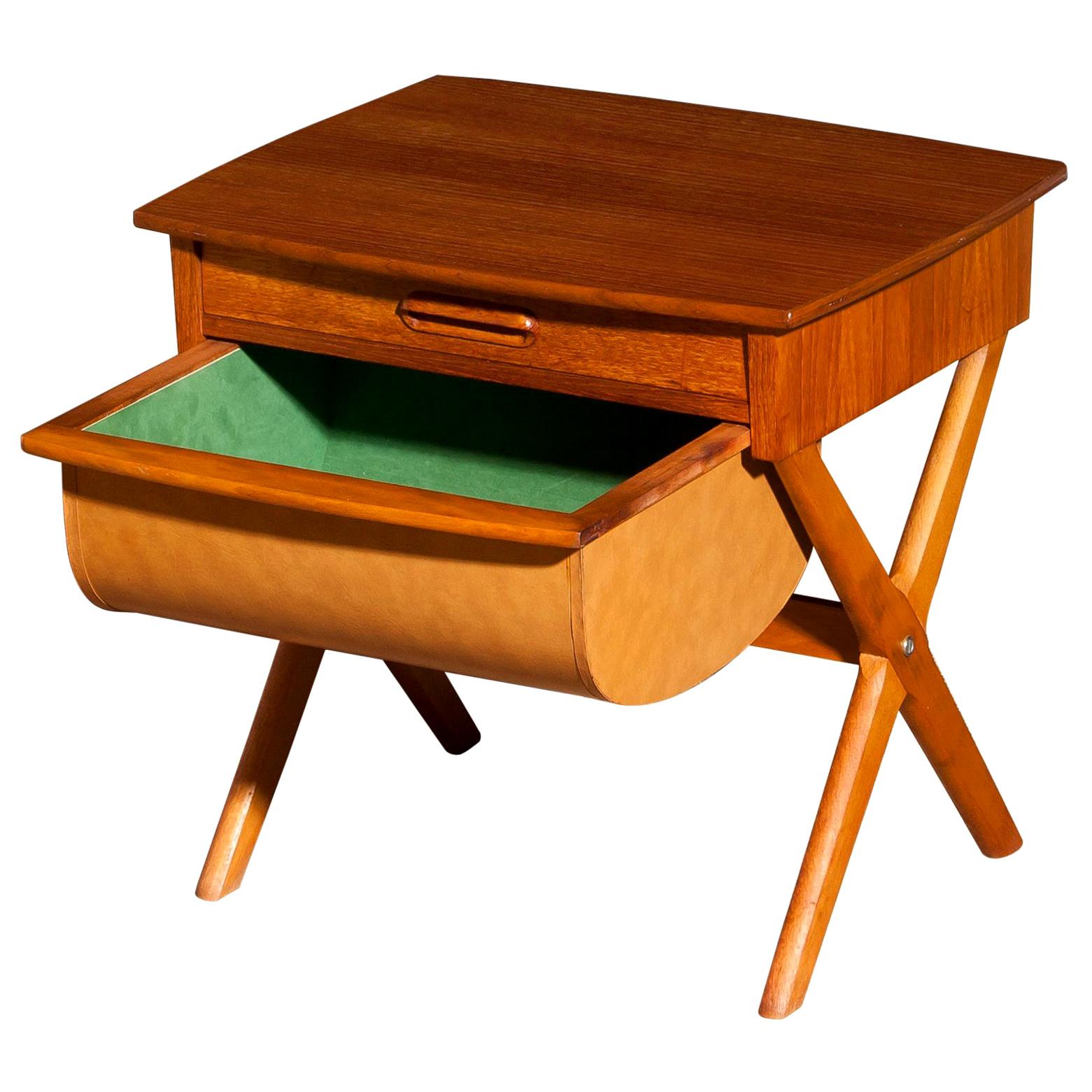Very nice sewing table made in Sweden.
This table is made of teak and has one normal drawer and one deep drawer.
It is in a beautiful condition.
Period 1960s.
Dimensions: H 52 cm x W 52 cm x D 45 cm.