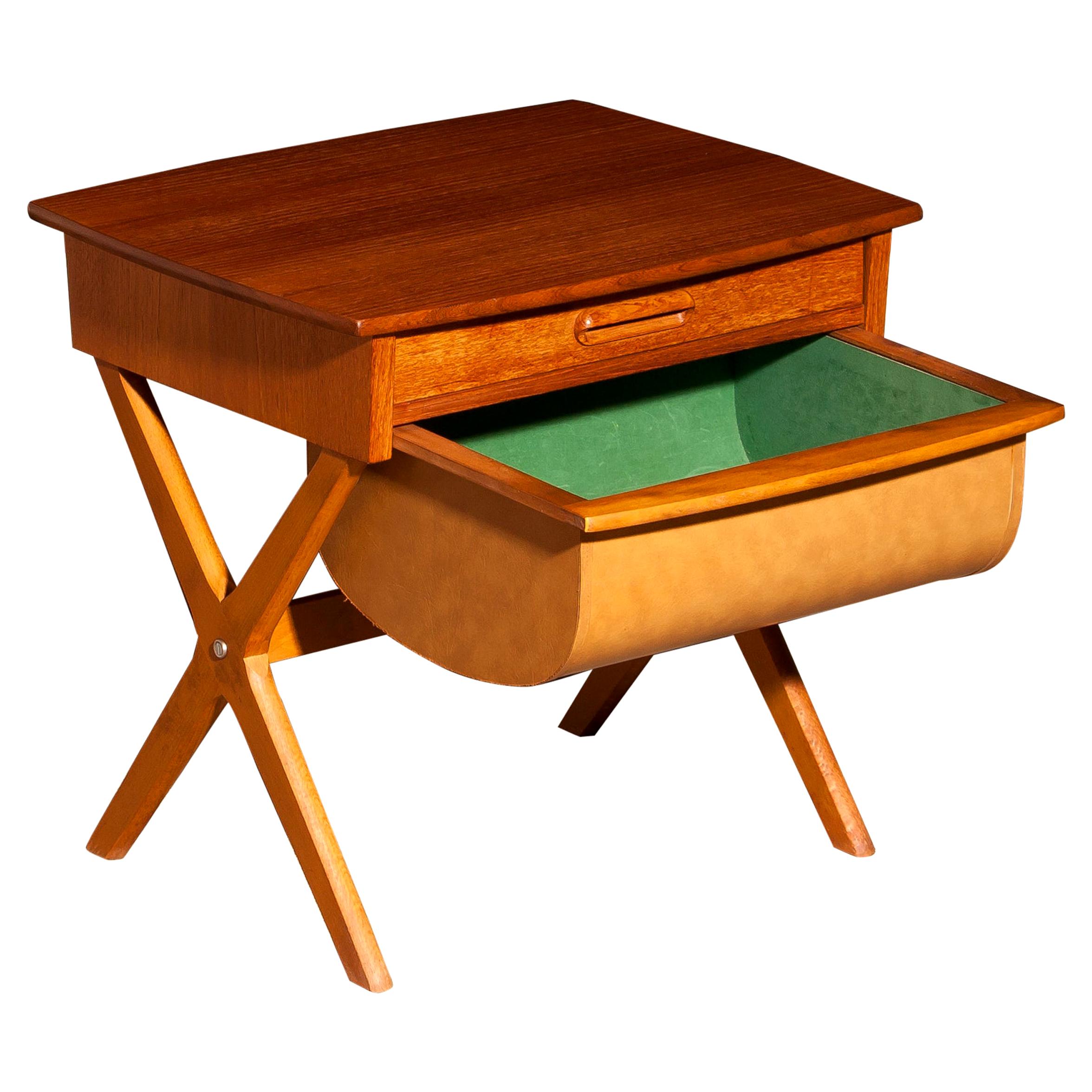 Very nice sewing table made in Sweden.
This table is made of teak and has one normal drawer and one deep drawer.
It is in a beautiful condition.
Period: 1960s.
Dimensions: H 52 cm x W 52 cm x D 45 cm.