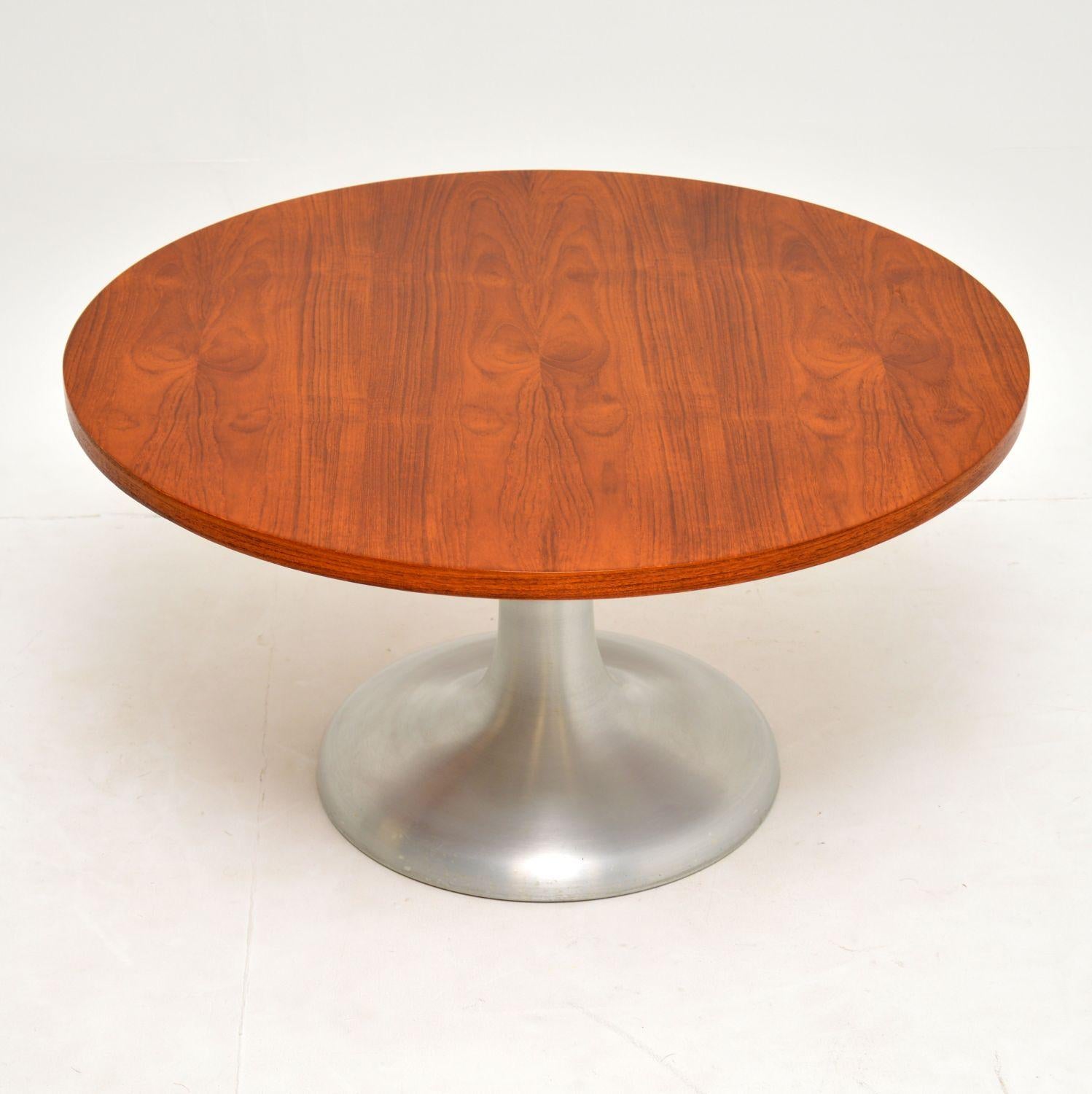 A stylish and very well made vintage coffee table, this dates from the 1960-70’s.

It has a beautiful circular teak top, and sits on a brushed steel tulip base. We have had the teak stripped and re-polished to a very high standard, the condition is