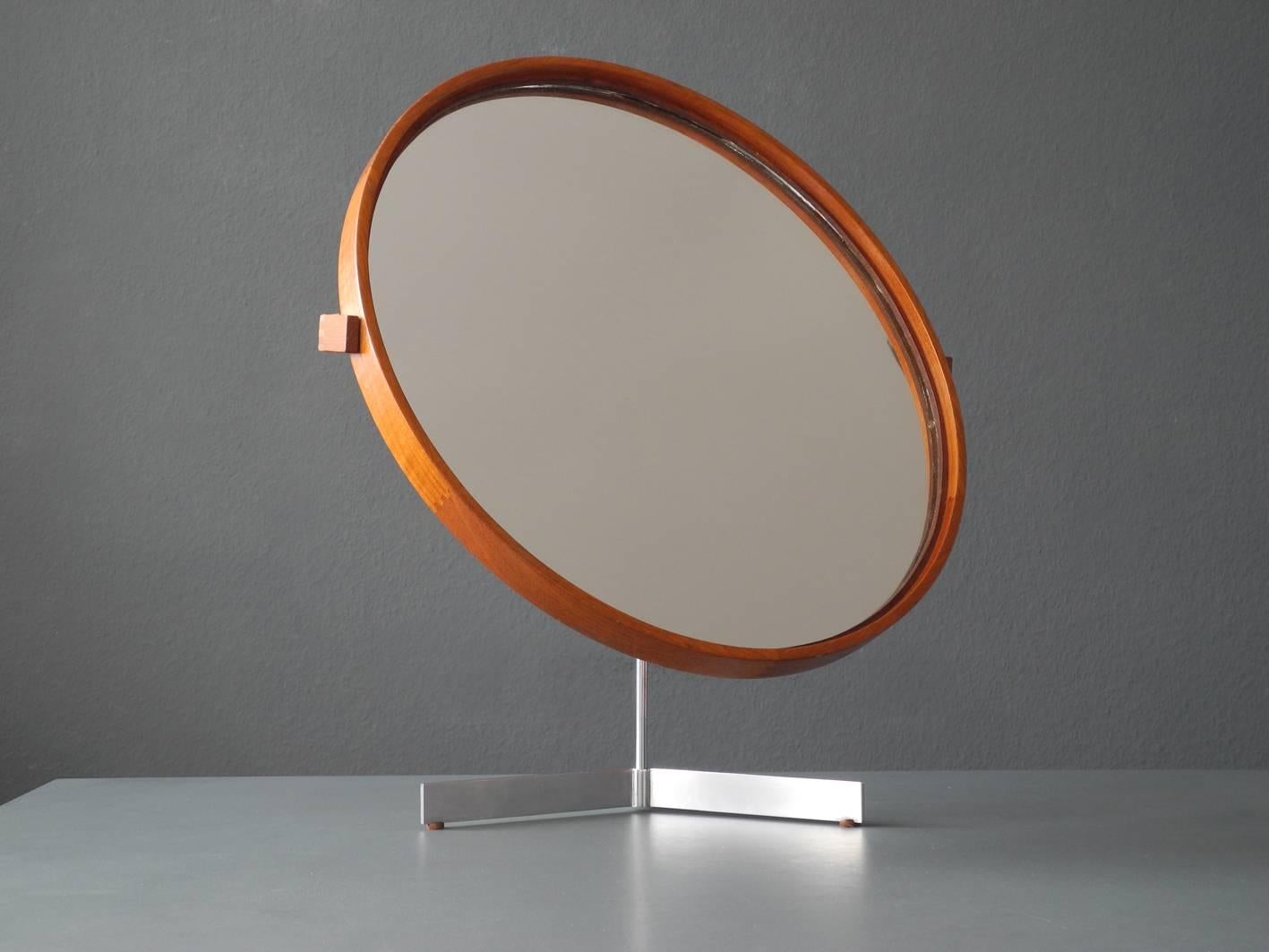 1960s beautiful original table vanity mirror of the brand Luxus Vittsjö Sweden with teak frame and a metal tripod foot. Mirror is rotatable in all directions and can be swivelled upwards. Made by Vittsjö Sweden. Designed by the brothers Uno & Östen