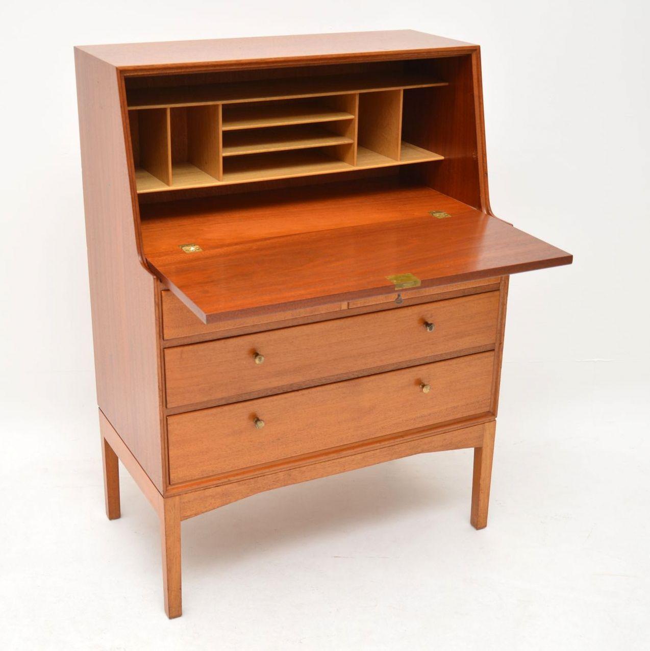 A stylish, extremely well made and very rare vintage bureau in teak, this was designed by John Morton and was made by LM furniture in the 1960s. It’s in superb condition for its age, with only some extremely minor wear here and there. This is clean,