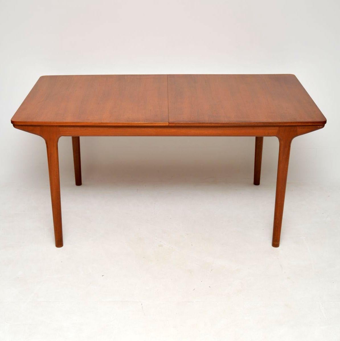 A top quality vintage extending dining table in teak, this was made by McIntosh, it dates from the 1960s. It’s in good condition for its age, with a lovely even colour throughout, and no major damage. There is just some minor wear to the polish and