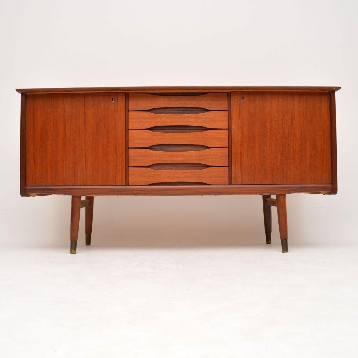 A stunning and rare vintage teak sideboard, this was made in Norway during the 1960s by Gustav Bahus, it was designed by Fredrik Kayser. It has a beautiful design, is of amazing quality and is a very practical size. The condition is excellent for