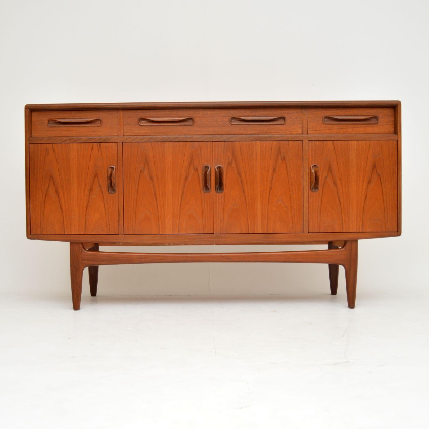 A stylish and highly sought after design, this teak vintage sideboard was made by G-Plan. It was designed by Victor Wilkins, and dates from the 1960s. The quality is superb, and the condition is excellent for its age. There is just some minor