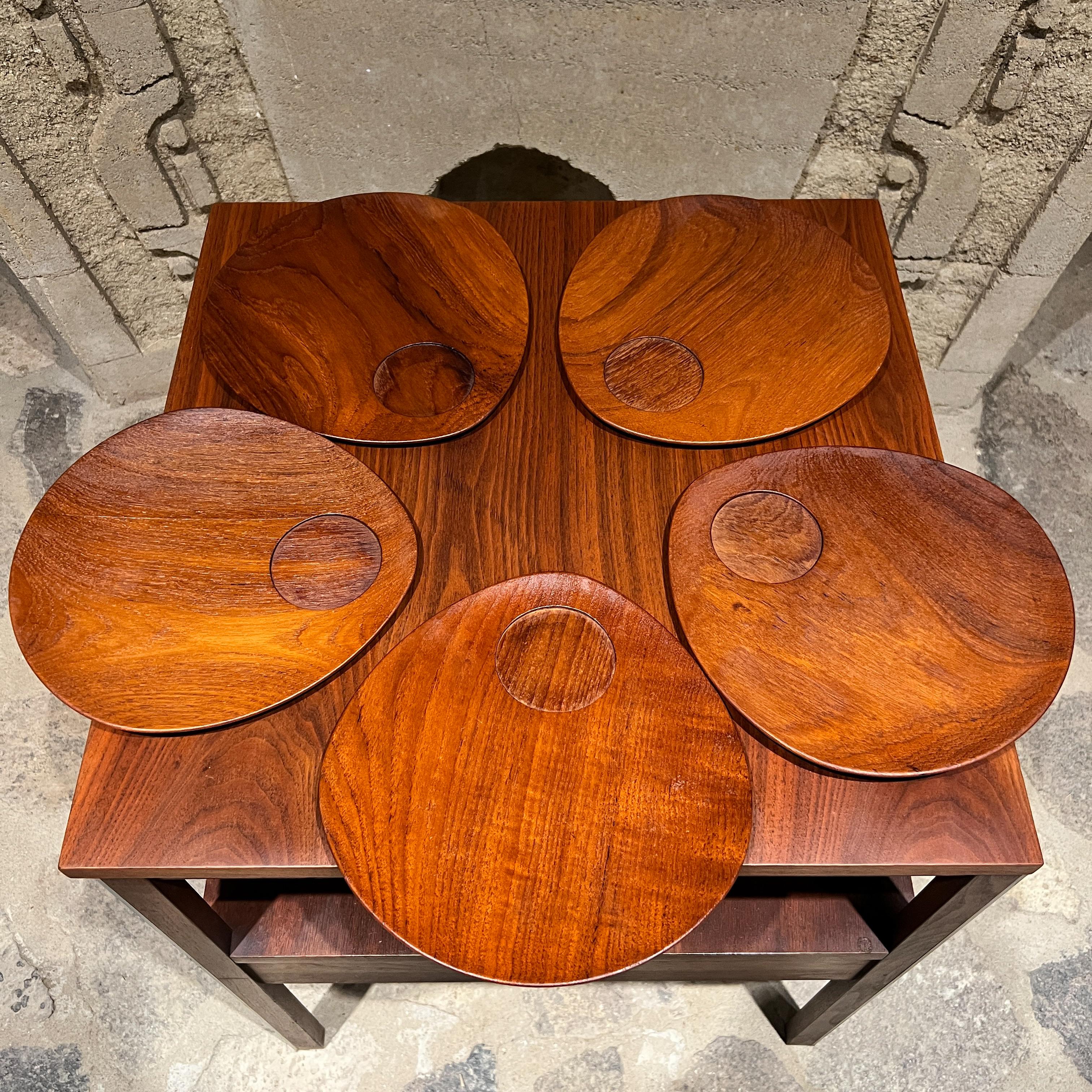 AMBIANIC presents
1960s Midcentury Modern Five Teakwood Breakfast Plates by Lunning INC Denmark
Stamped by maker.
This set of 5 teardrop shaped breakfast plates feature a practical circular drill-out space ideal for cup.
9.5 w x 9.75 d x