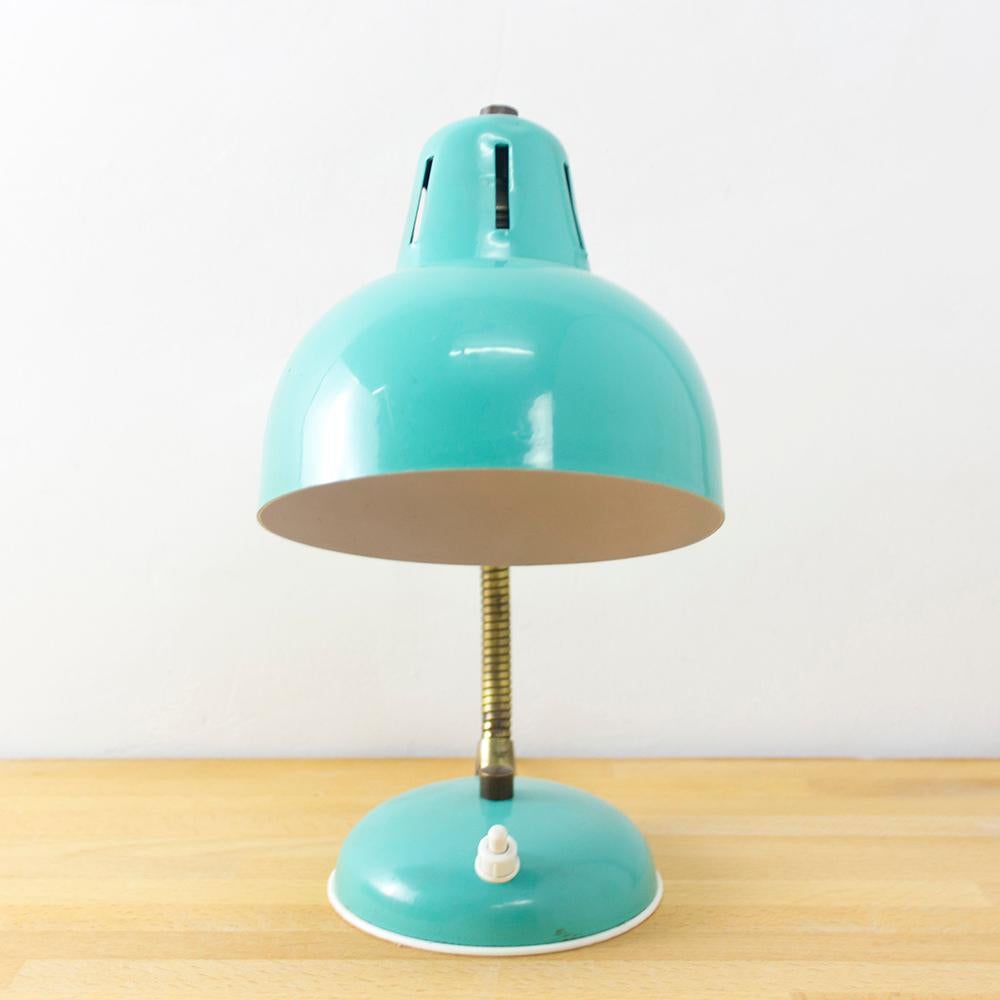 Midcentury, table lamp, teal and bronze metal finish, European plug (up to 250V), 1960s.

A flexible lamp that brings a happy pop of color to any space. This lamp has a classically rounded shade what opens wide at the bottom. The bronze metal arm
