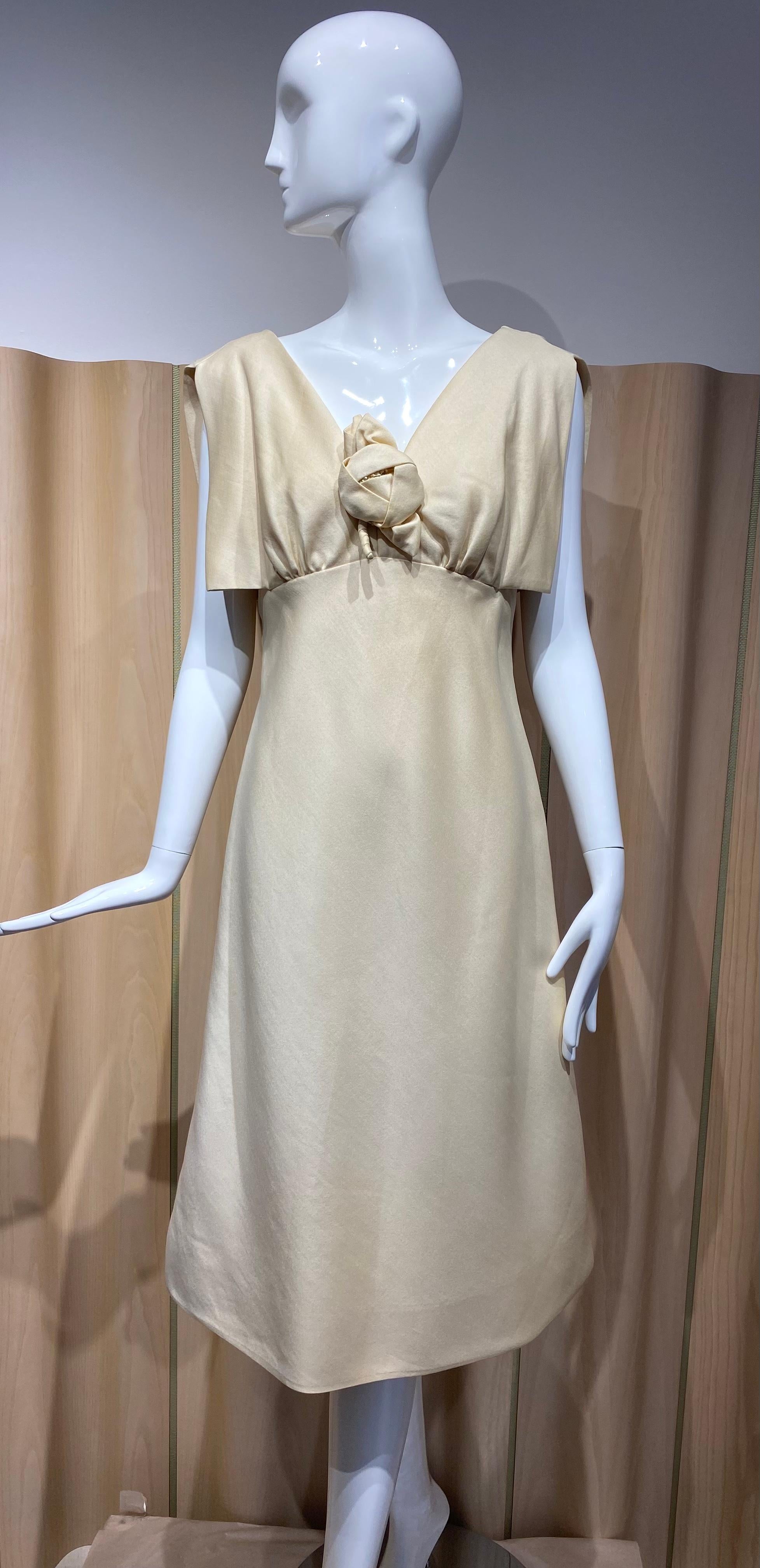 1960s Teal Traina ivory/champagne color silk V neck A line cocktail dress with rosette appliqué. 
Perfect for engagement party or wedding.
Size: Medium
Measurement:
Bust 38”/  Waist 30: / Hip 36’/ Dress length 40”