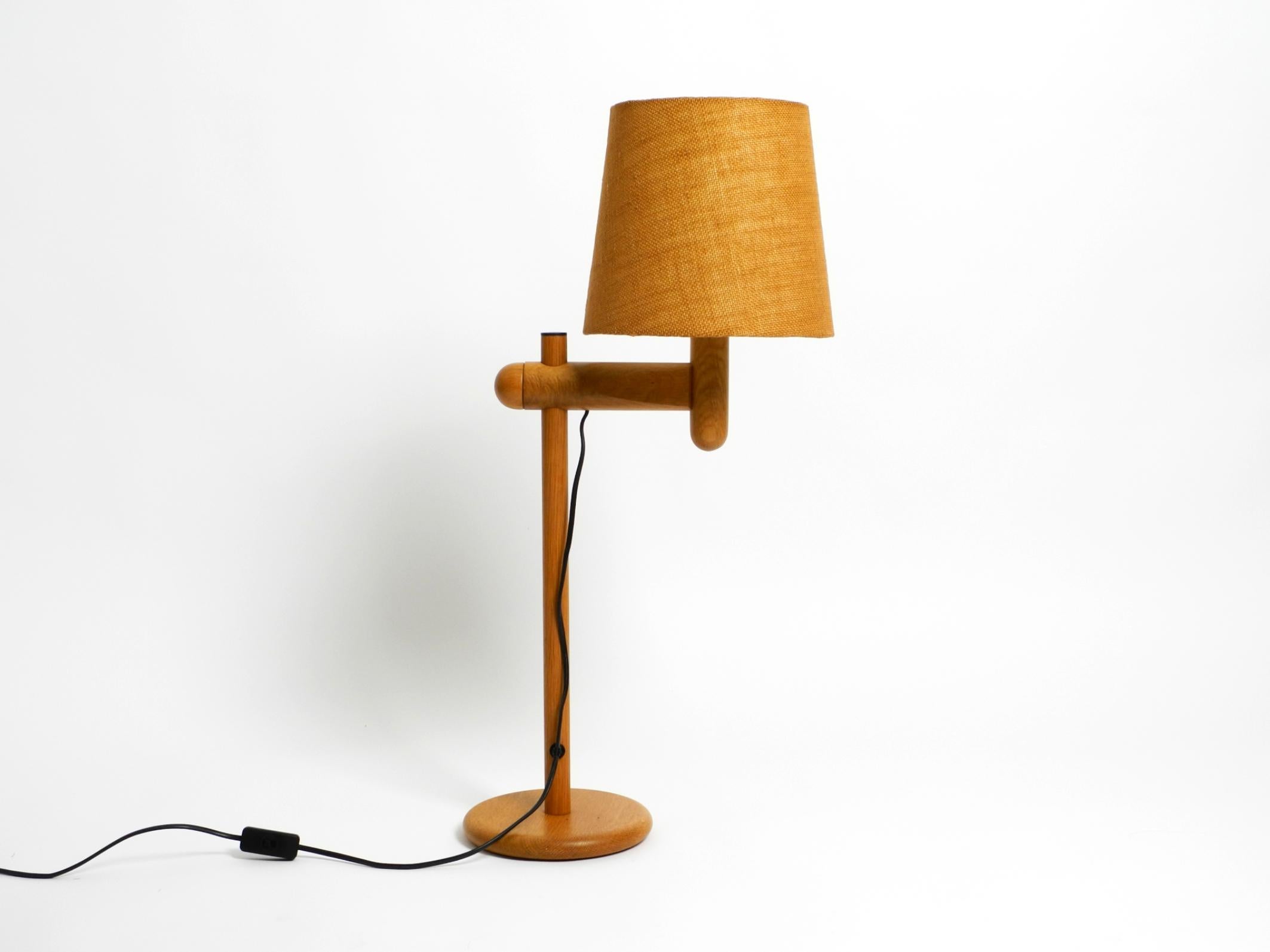 Mid-Century Modern 1960s Temde table lamp made of oak wood and with height-adjustable shade For Sale