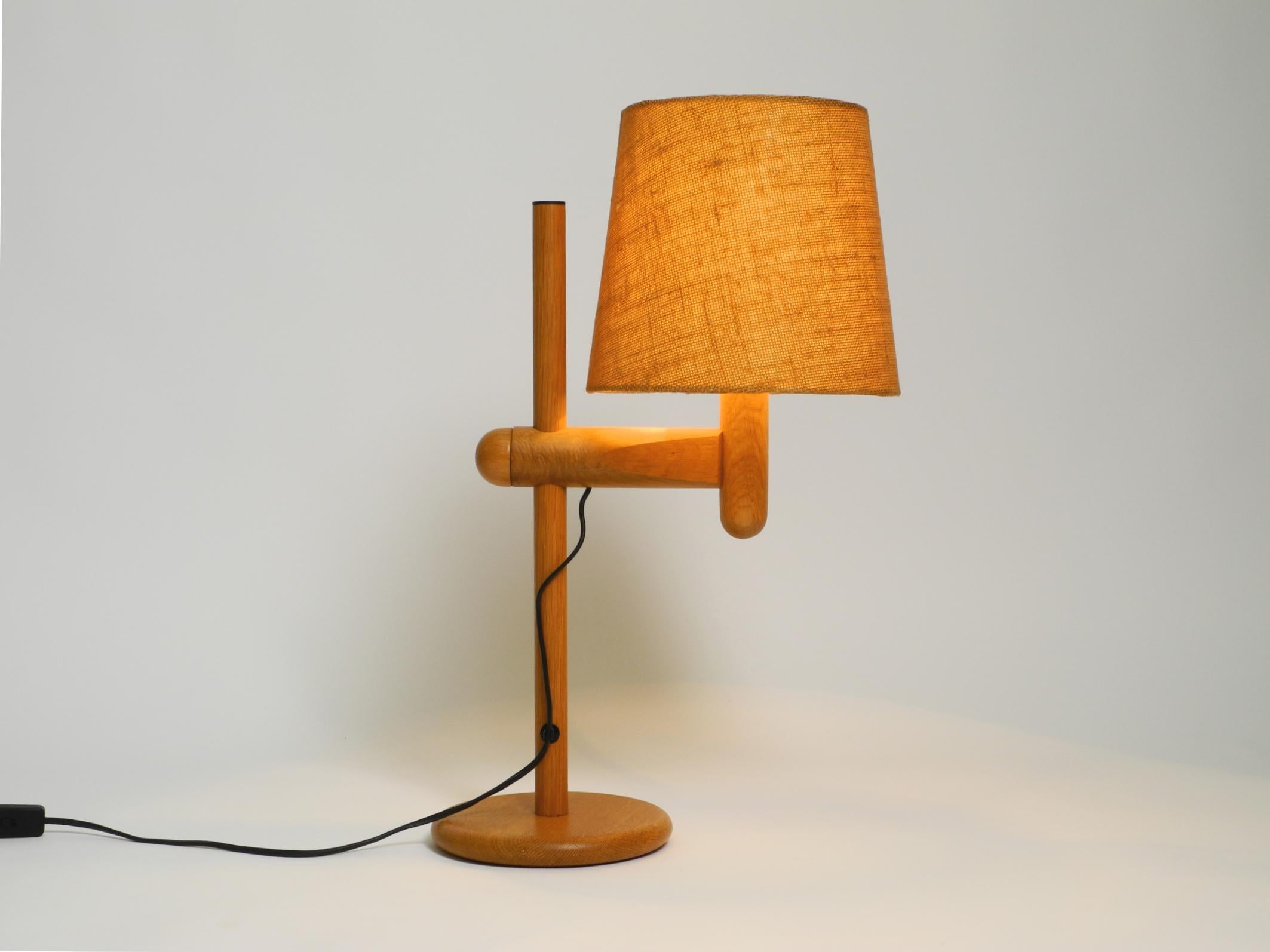 Mid-20th Century 1960s Temde table lamp made of oak wood and with height-adjustable shade For Sale