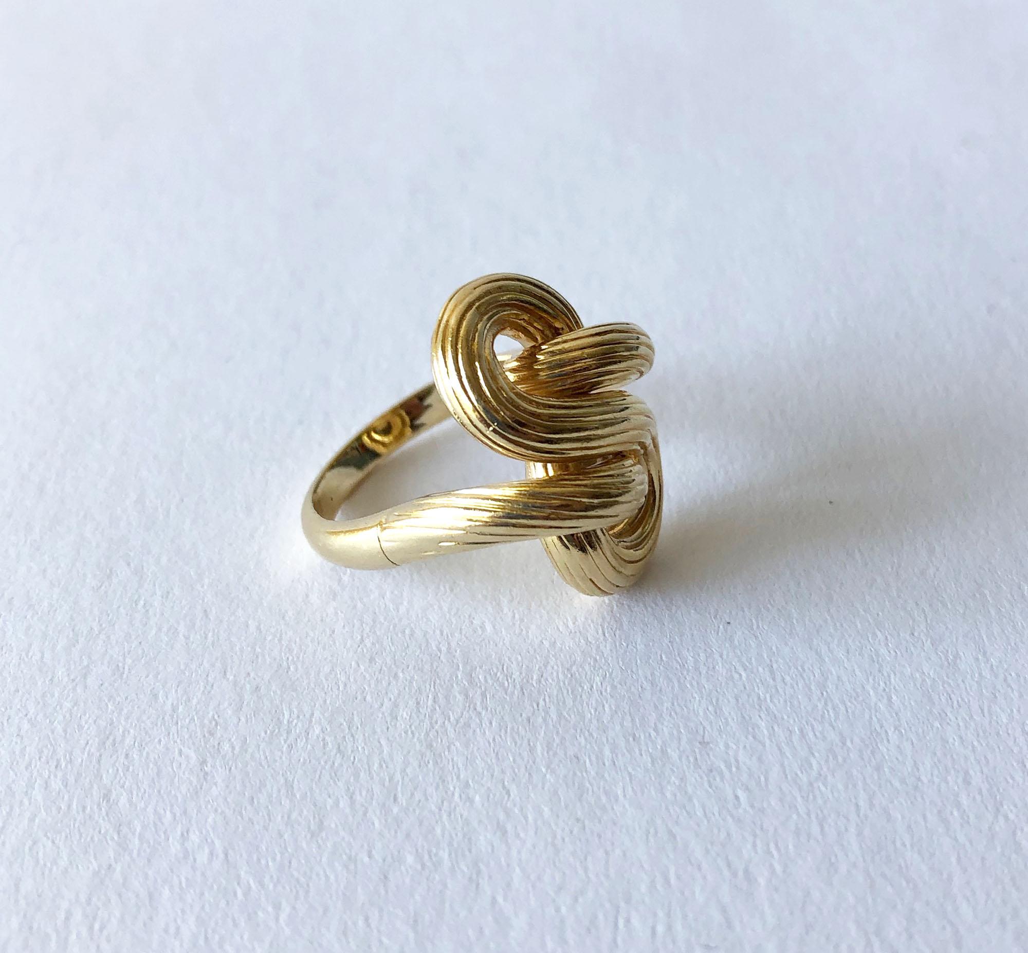 Florentined 14K gold knot ring, circa 1960's.  Ring is a finger size 8.5 - 9 and is signed 14K.  In very good vintage condition.  10.4 grams.