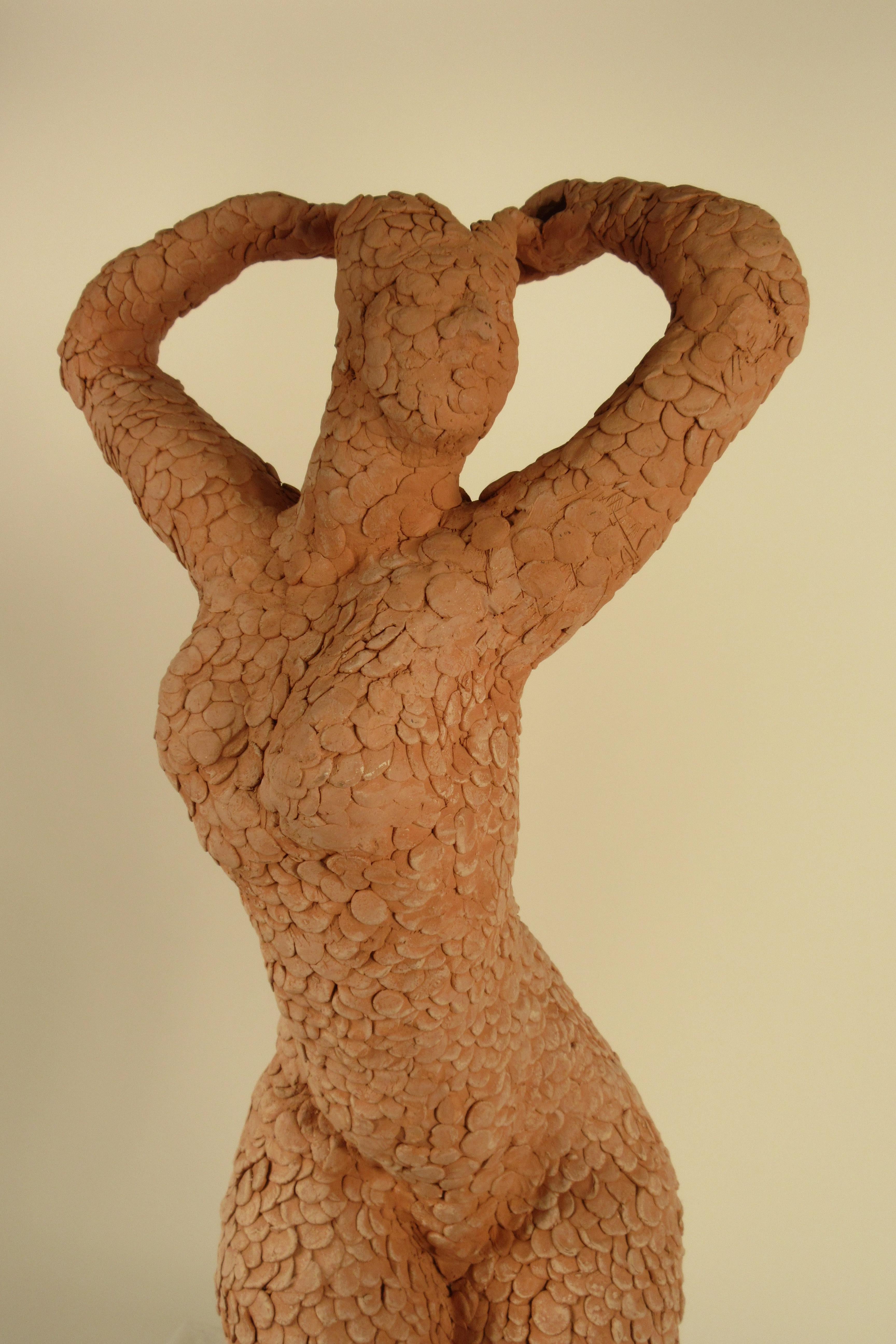 1960s textured clay sculpture of nude woman.