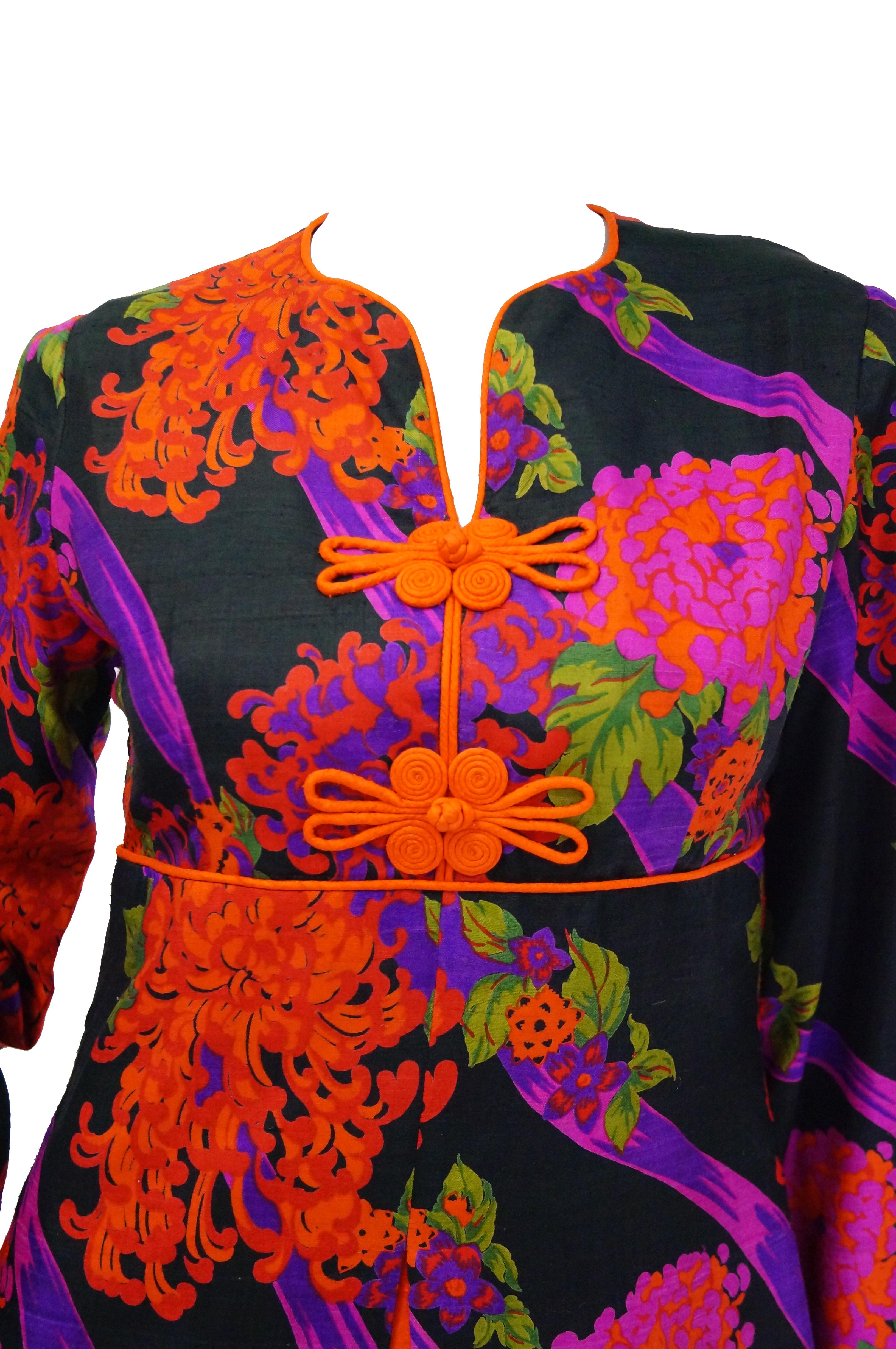 Stunning colorful floral dress made of smooth Thai silk. The dress is maxi length, with long, loose sleeves, an empire silhouette, and a high neckline with narrow V - neck slit. The print of the dress is just fantastic - chrysanthemums in neon pinks