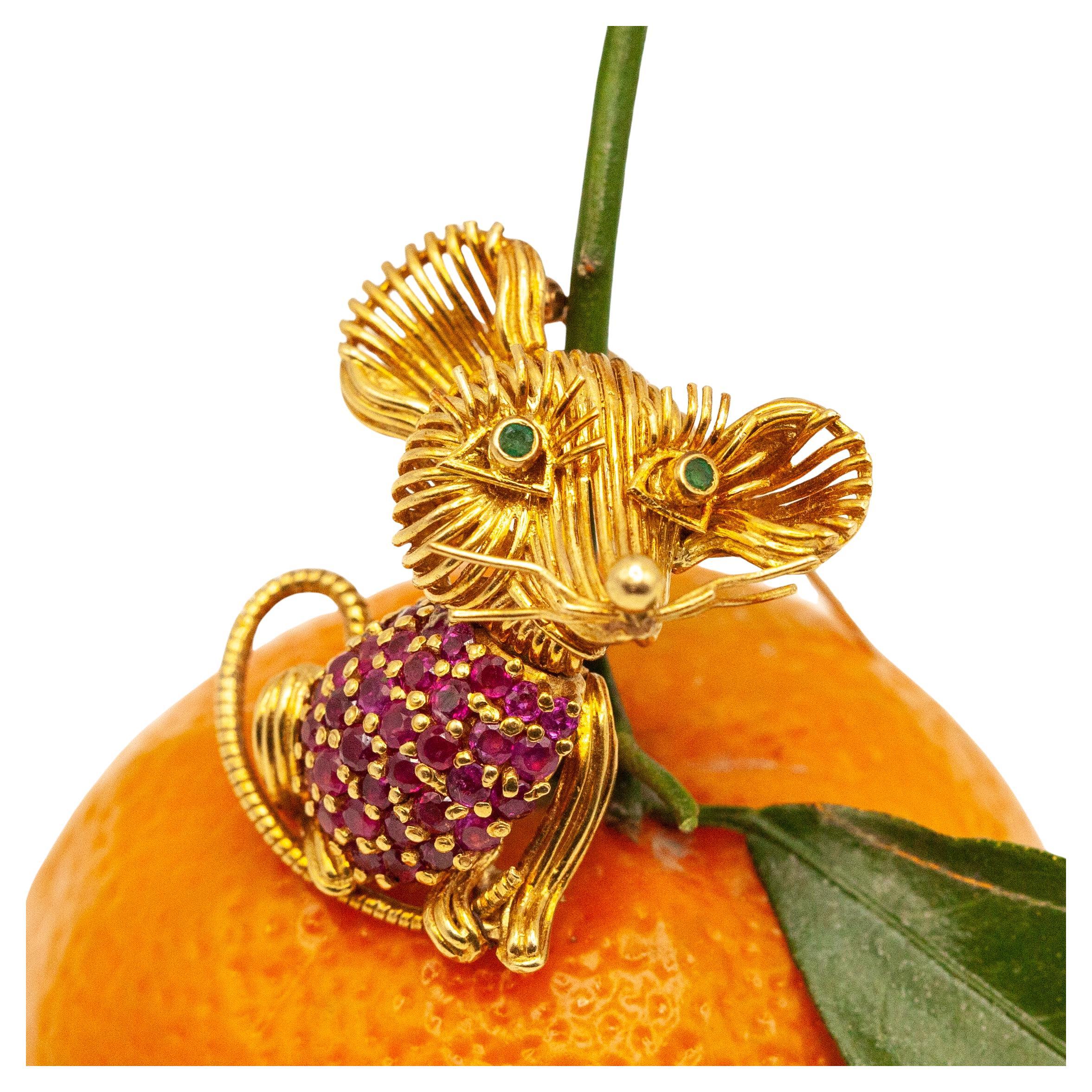Stunning 1960s Tiffany & Co. mouse brooch in 18K yellow gold with 36 round cut rubies and 2 emeralds

Approximate Weight:
Gross - 14.90 grams
Ruby - 2.00cts

Approximate Measurement:
1.16