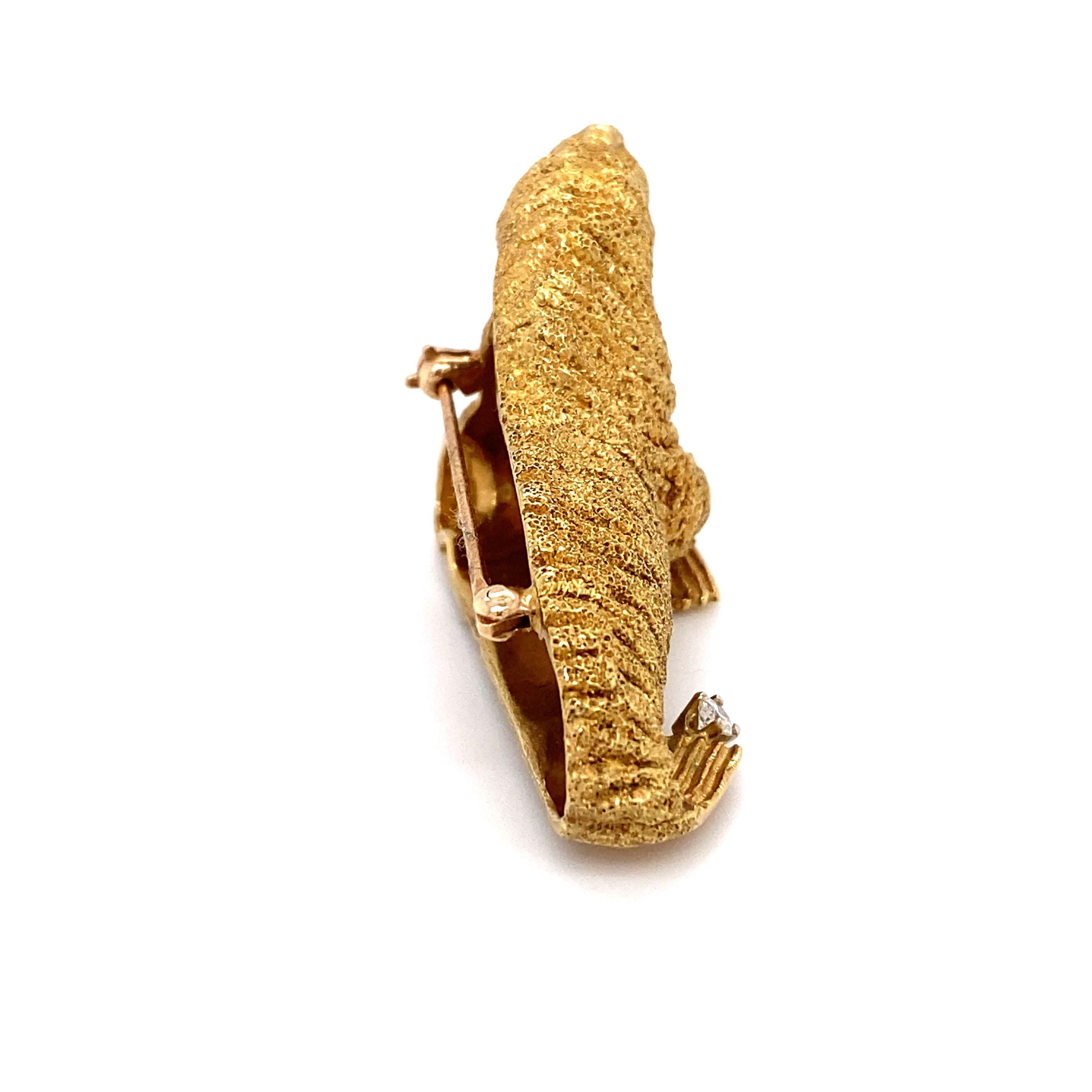 Item Details: This whimsical brooch by Tiffany & Co. is masterfully crafted in 18 karat yellow gold. 
It features an accent diamond and rubies for eyes.

Circa: 1960s
Metal Type: 18 Karat Yellow Gold
Weight: 24.4 grams
Dimensions: 1.5 inch