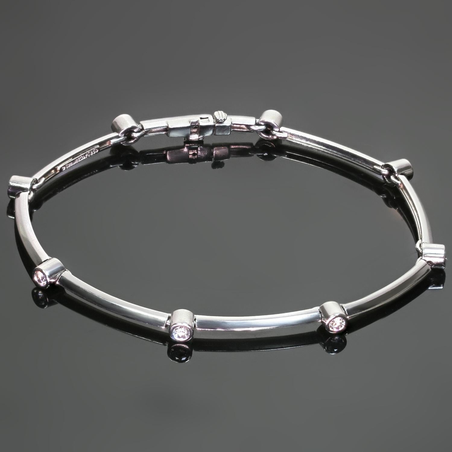 This classic Tiffany & Co. bracelet is crafted in platinum and features slender bars alternating with bezel-set with round brilliant F-G VS1-VS2 diamonds weighing an estimated 0.60 carats. Made in United States circa 1960s. Measurements: 0.15