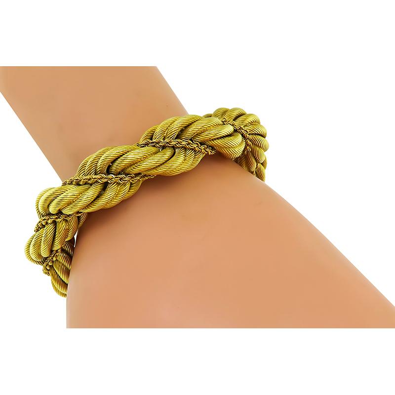 This is a fabulous 18k yellow gold bracelet by Tiffany & Co. The bracelet features impressive rope design. The bracelet measures 6 inches in length and 14mm in width. The bracelet is signed TIFFANY&Co. ITALY 18K and weighs 65.7 grams.

Inventory