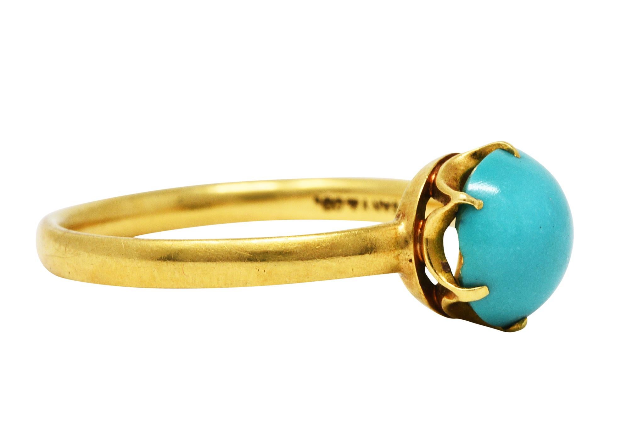 Gemstone ring centers a 7.3 mm round turquoise cabochon

Opaque with uniform greenish blue color and no face-up matrix - signed by cutter

Talon set in a stylized belcher head

Tested as 18 karat gold

Fully signed Tiffany & Co.

Circa: 1960s

Ring