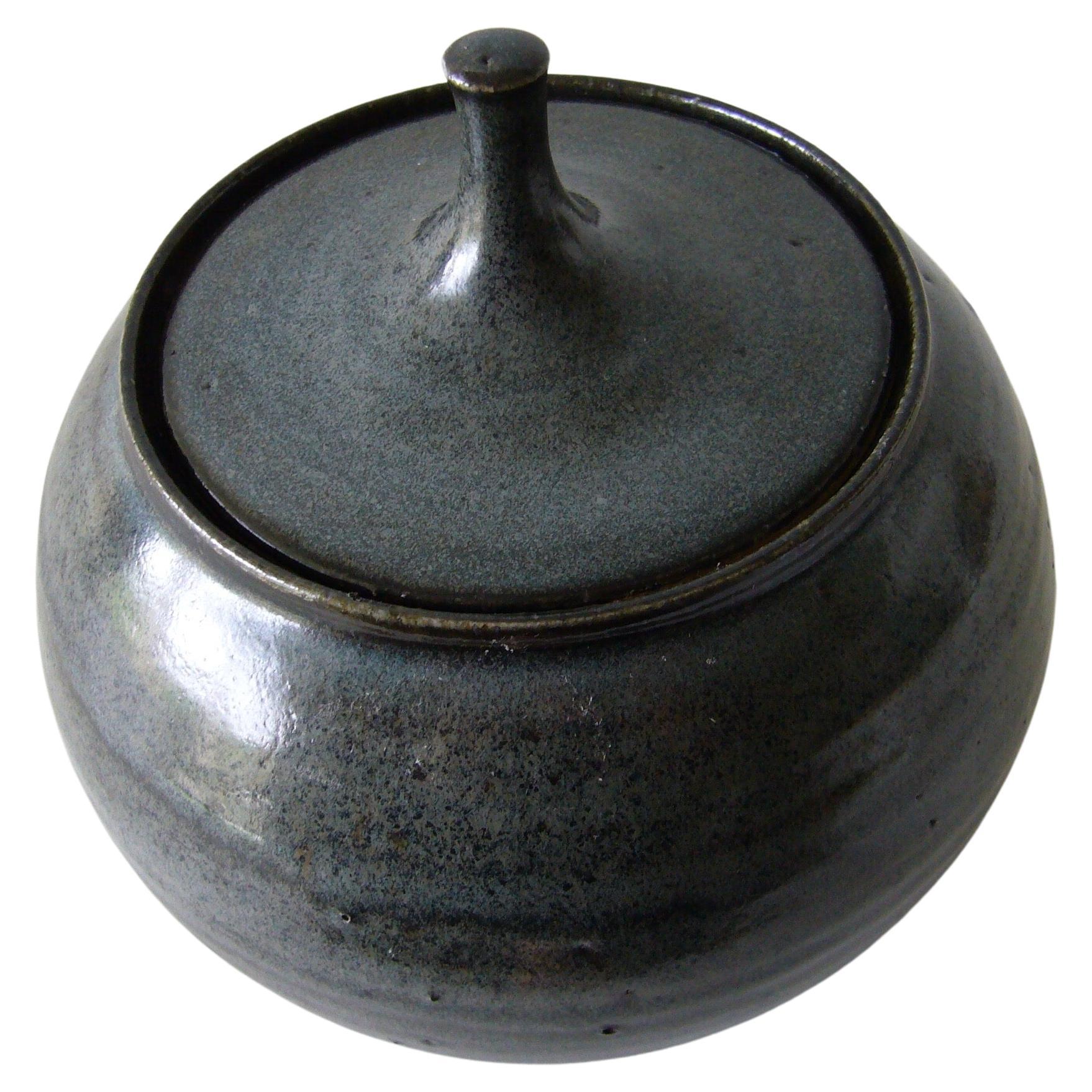 California stoneware studio pottery lidded vessel made by Tom McMillin.  Piece stands 7
