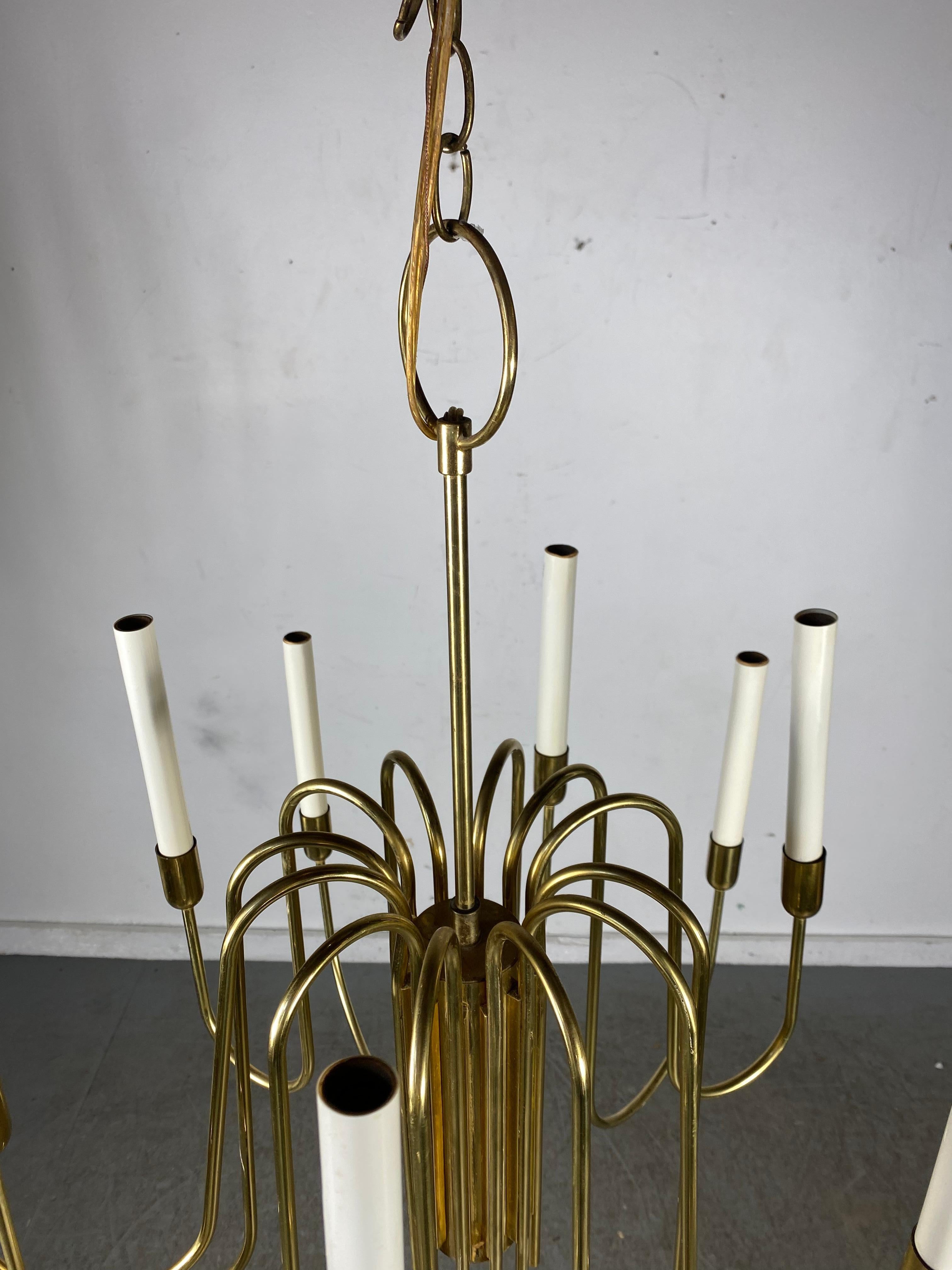 Stunning 1960s Mid-Century Modern brass chandelier in the style of Tommi Parzinger made by Lightolier, Tested and electrical working.
